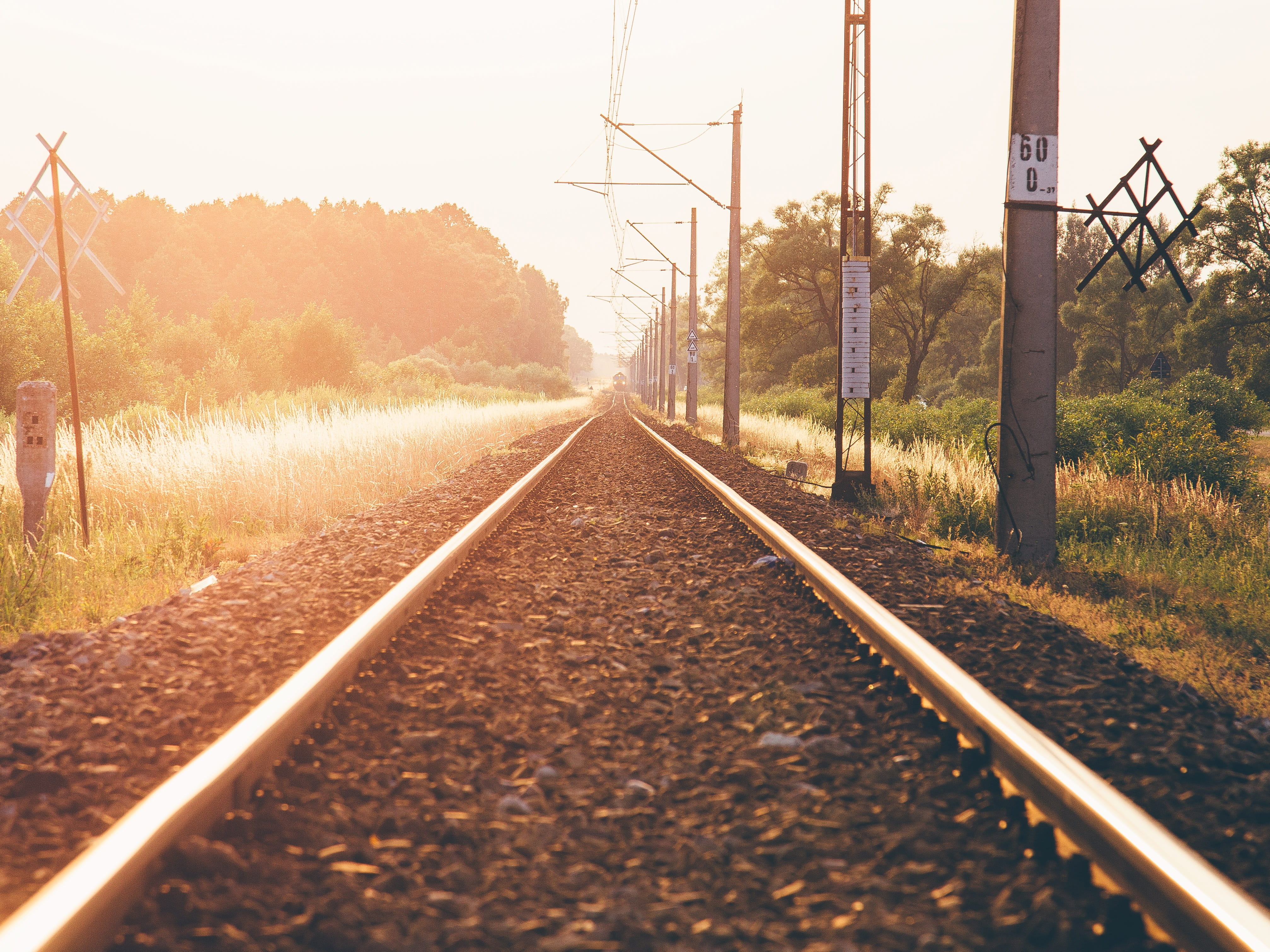 railroad, gravel, clear sky, railroad track, parallel, land, plant, vanishing point, rail transportation, 4K, long, electricity, sunset, no people, train tracks, HD Wallpaper