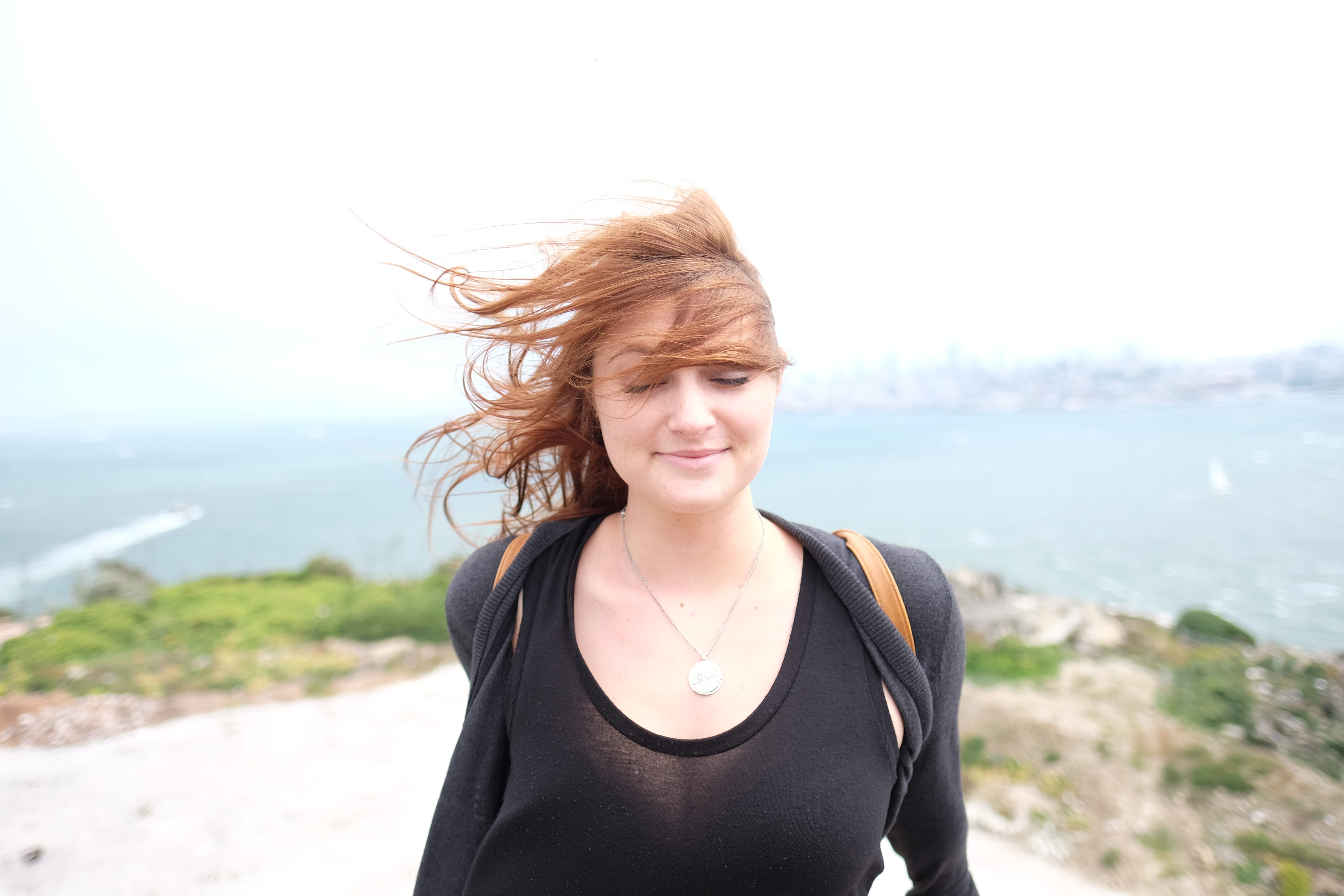 model, standing, #windswept, redhead, young women, long sleeve, #peaceful, outdoors, land, beautiful, clothing, tousled hair, #smiling, human hair, 4K, HD Wallpaper