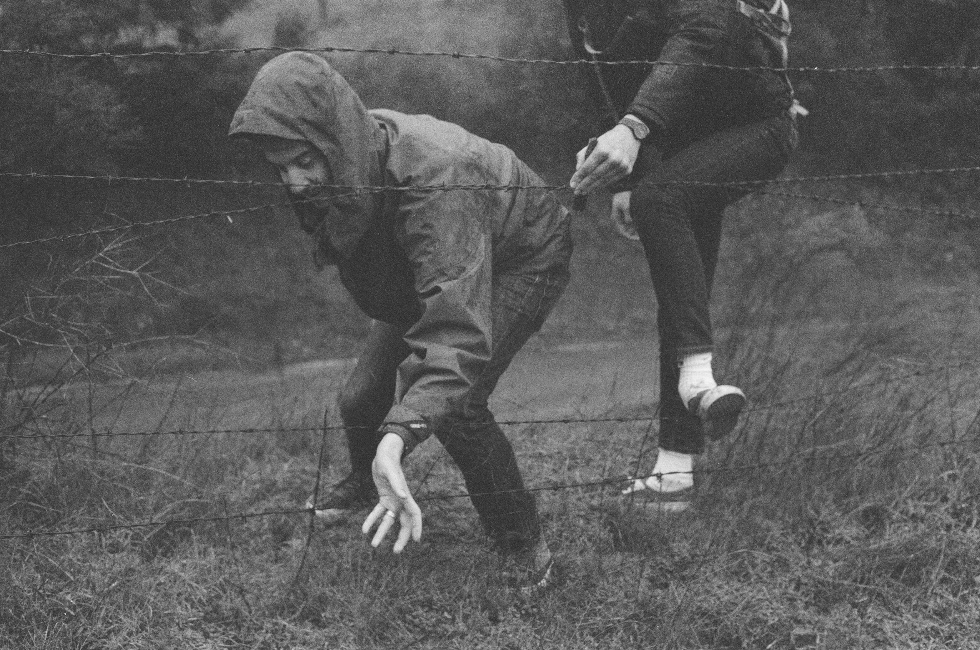 people, men, standing, hood, males, leisure activity, barbed wire, nature, field, togetherness, land, concepts And Ideas, man, grass, Grime, two people, HD Wallpaper