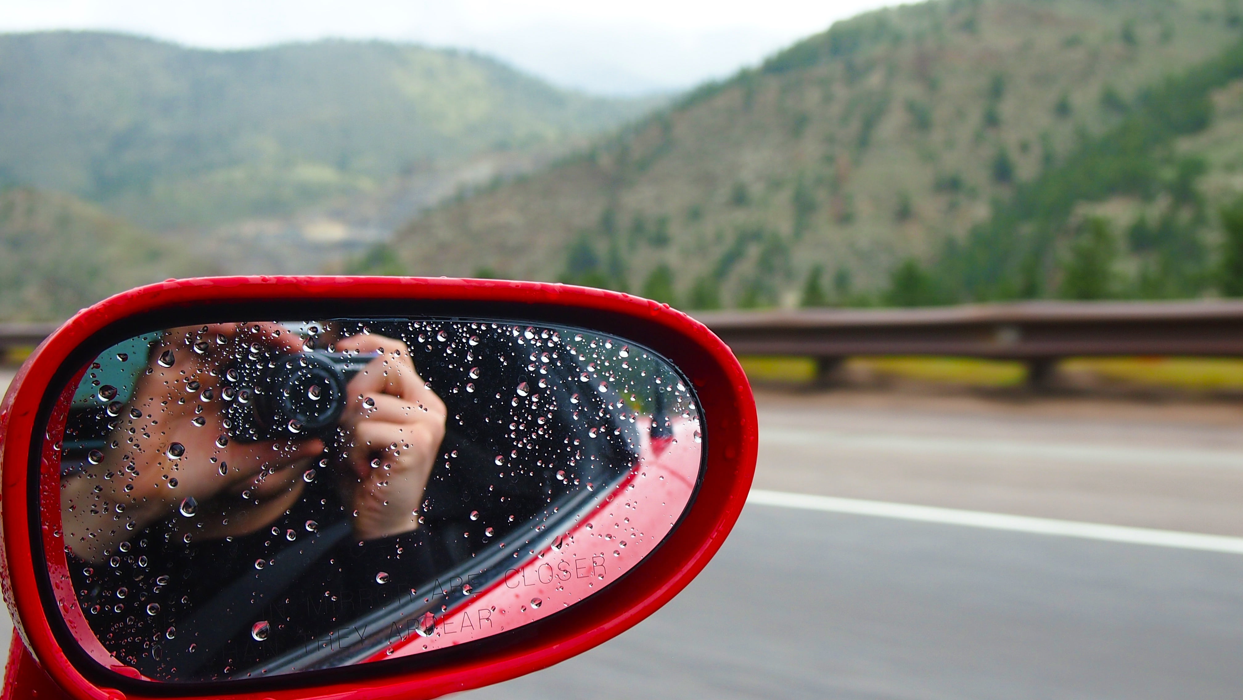 people, are closer than they appear, real people, camera, travel, nature, focus on foreground, person, day, rain residue, road, rain drops, side-view mirror, HD Wallpaper