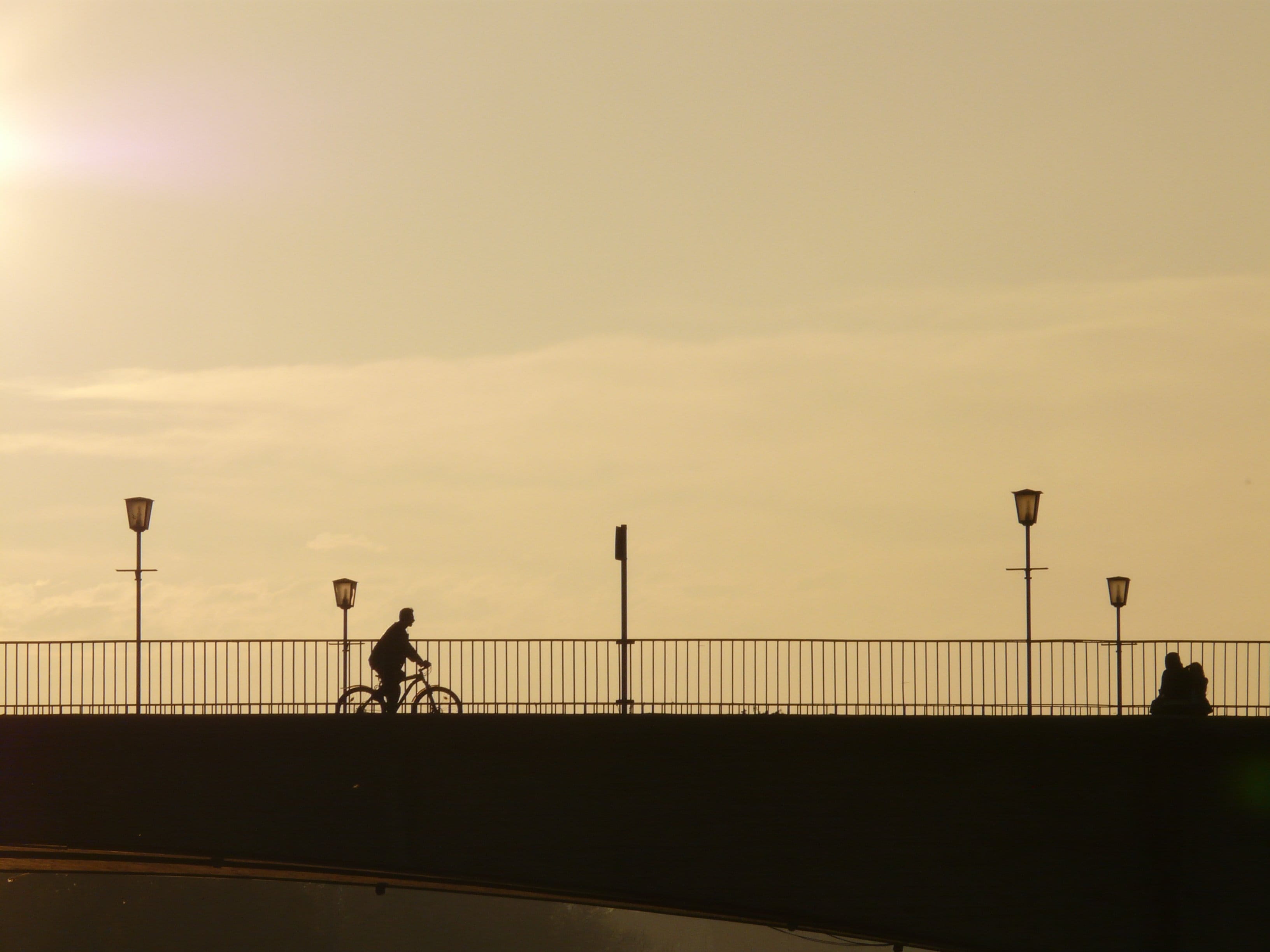 city, men, lifestyles, one person, 2K, light, sky, Silhouette, bridge - man made structure, everyday life, Bridge, leisure activity, ride, real people, HD Wallpaper