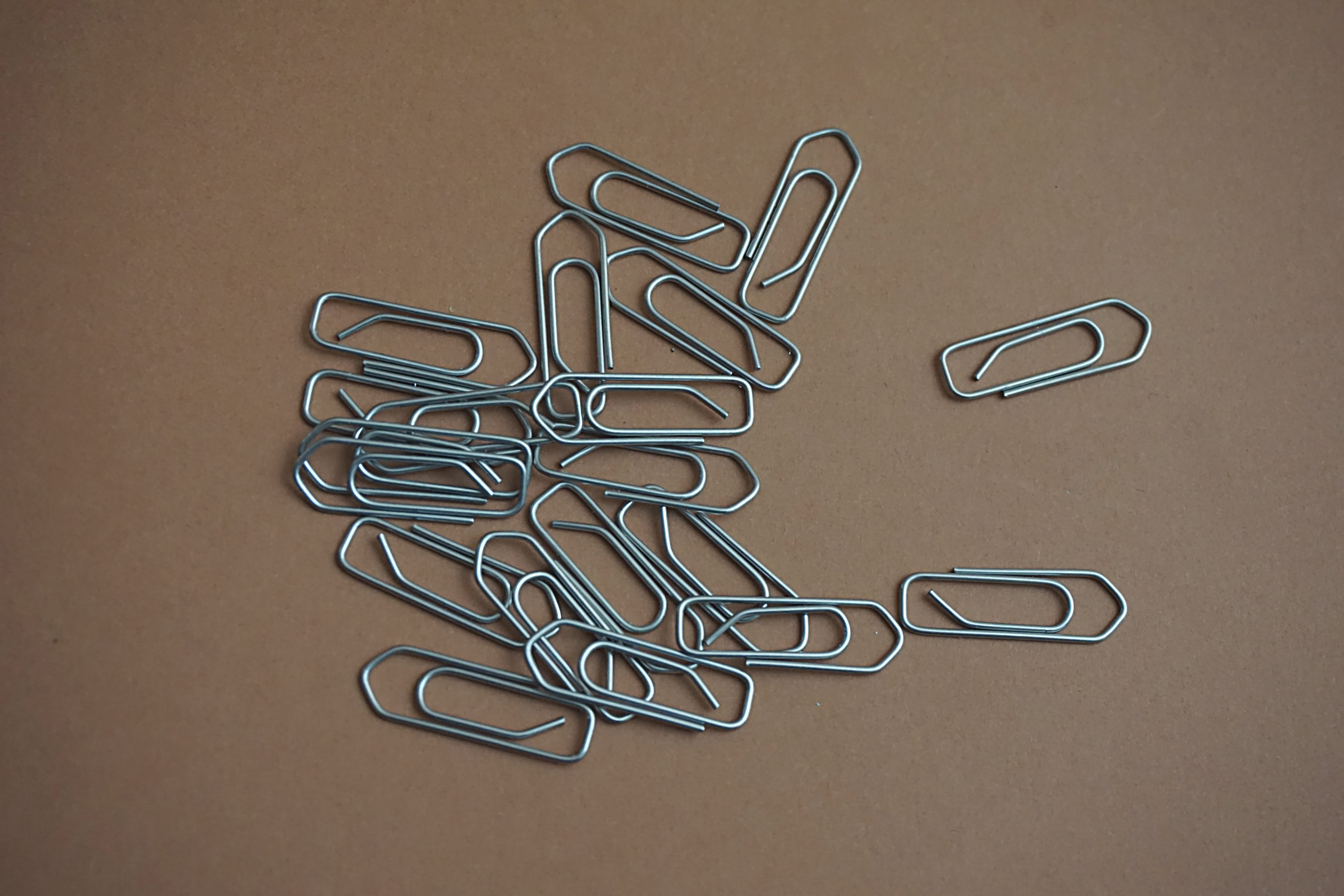 thing, steel, paper clip, school, solid, connection, silver colored, brown background, business, studio shot, organization, colored background, indoors, HD Wallpaper