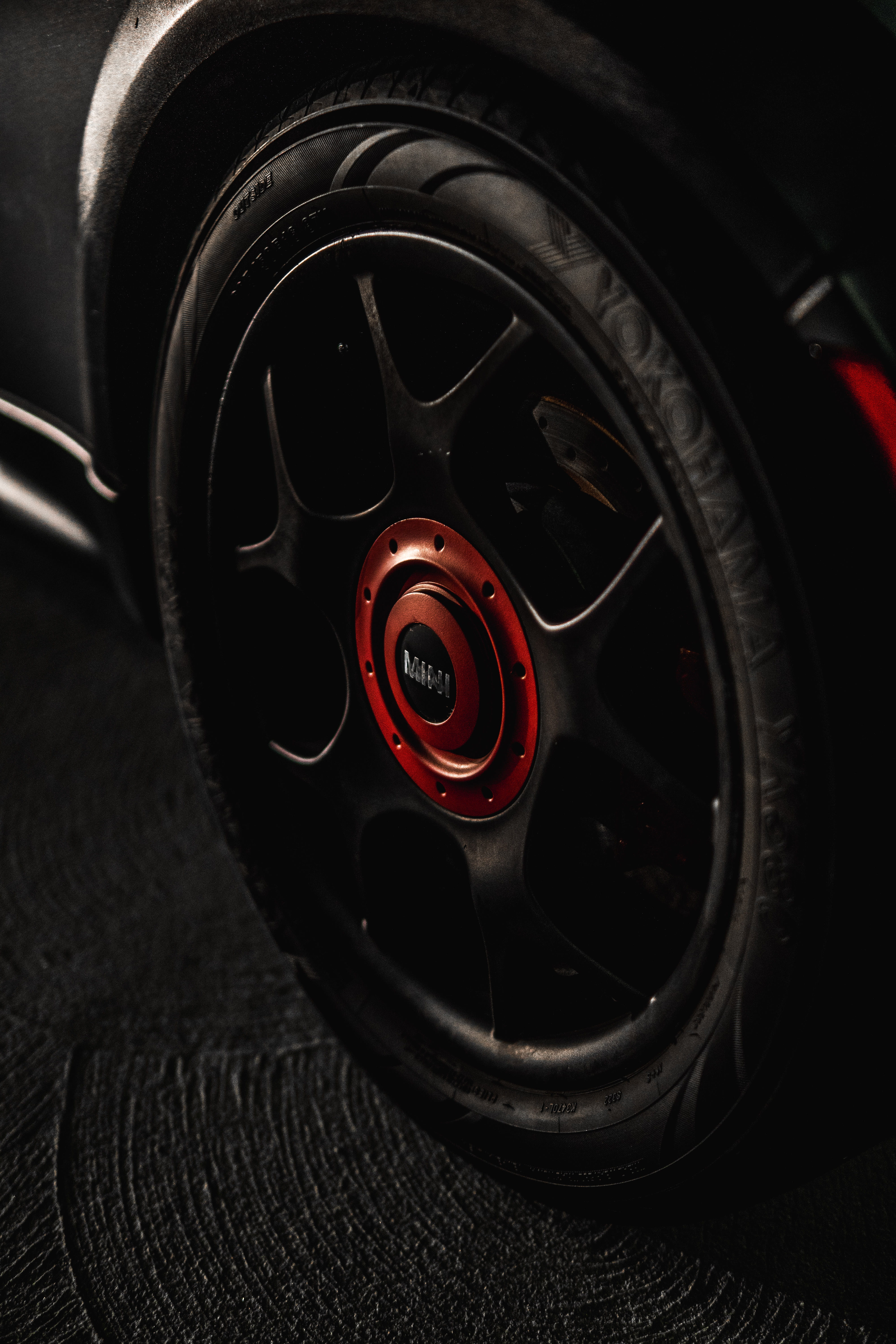 mini, rim, shape, vehicle interior, mini cooper, red, alloy, metal, black, focus on foreground, 5K, land vehicle, cooper, wheel, car, supercharged, black color, Phone HD Wallpaper