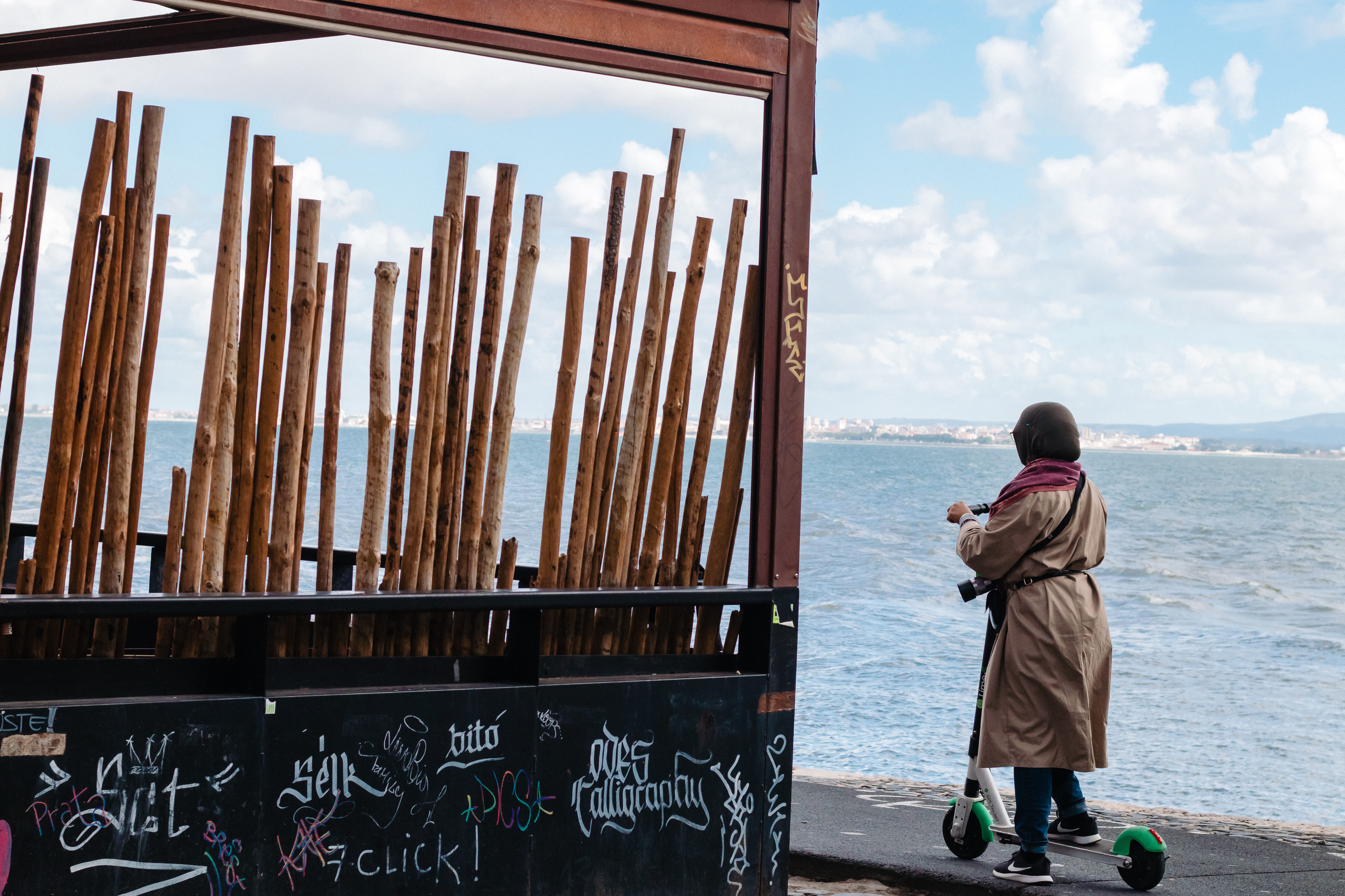 footwear, sea, muslim, lisbon, art, men, sky, 5K, outdoors, shoe, rear view, electric scooter, architecture, plant, water, one person, real people, leisure activity, HD Wallpaper