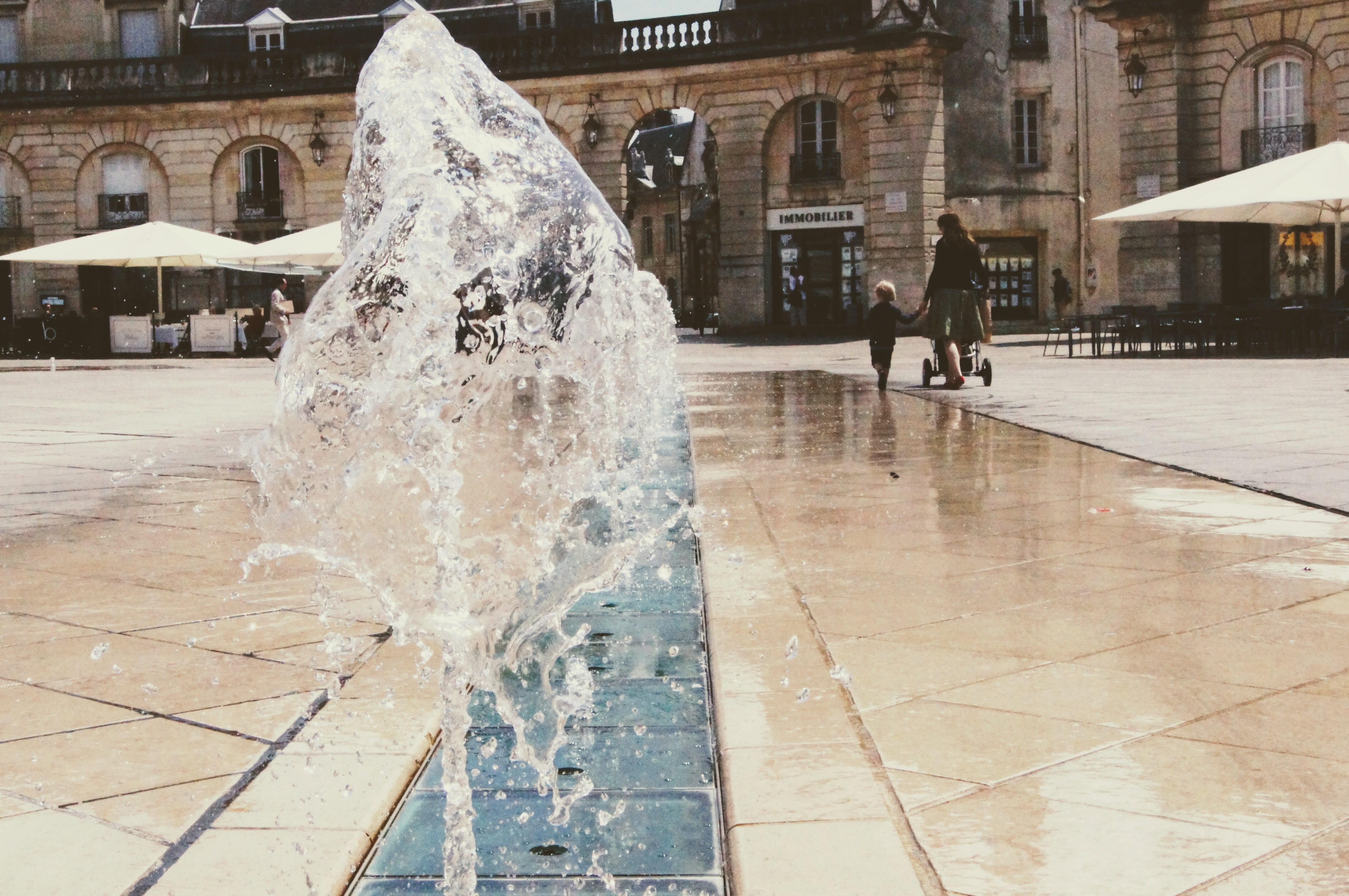 outdoors, fountain, day, wet, spraying, built structure, 4K, dijon, city, water, real people, street, building exterior, building, rain, unrecognizable person, HD Wallpaper