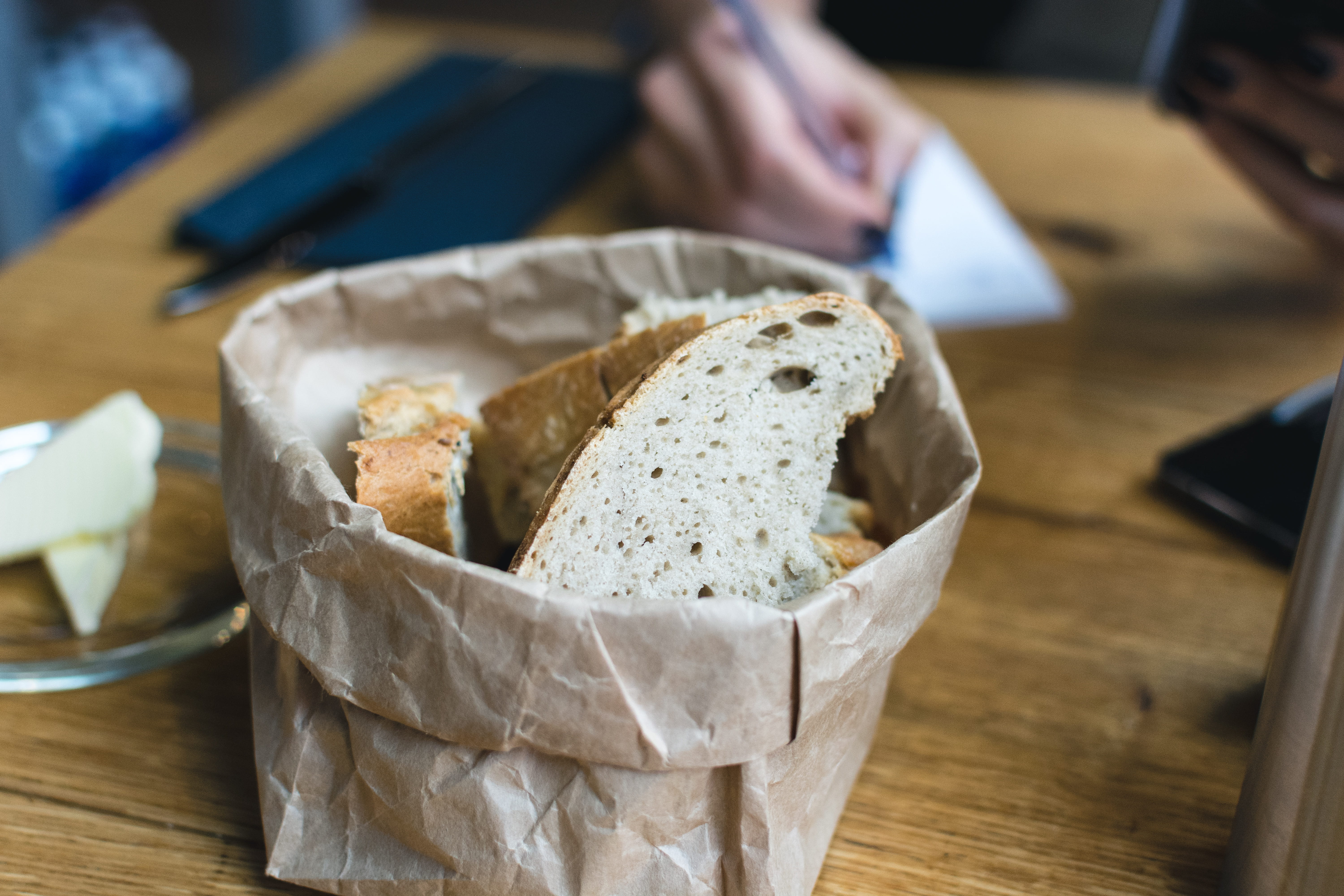 focus on foreground, holding, hands, close up, healthy Eating, snack, human hand, bread, wood - material, freshly, butter, hand, food and drink, meal, dairy product, HD Wallpaper