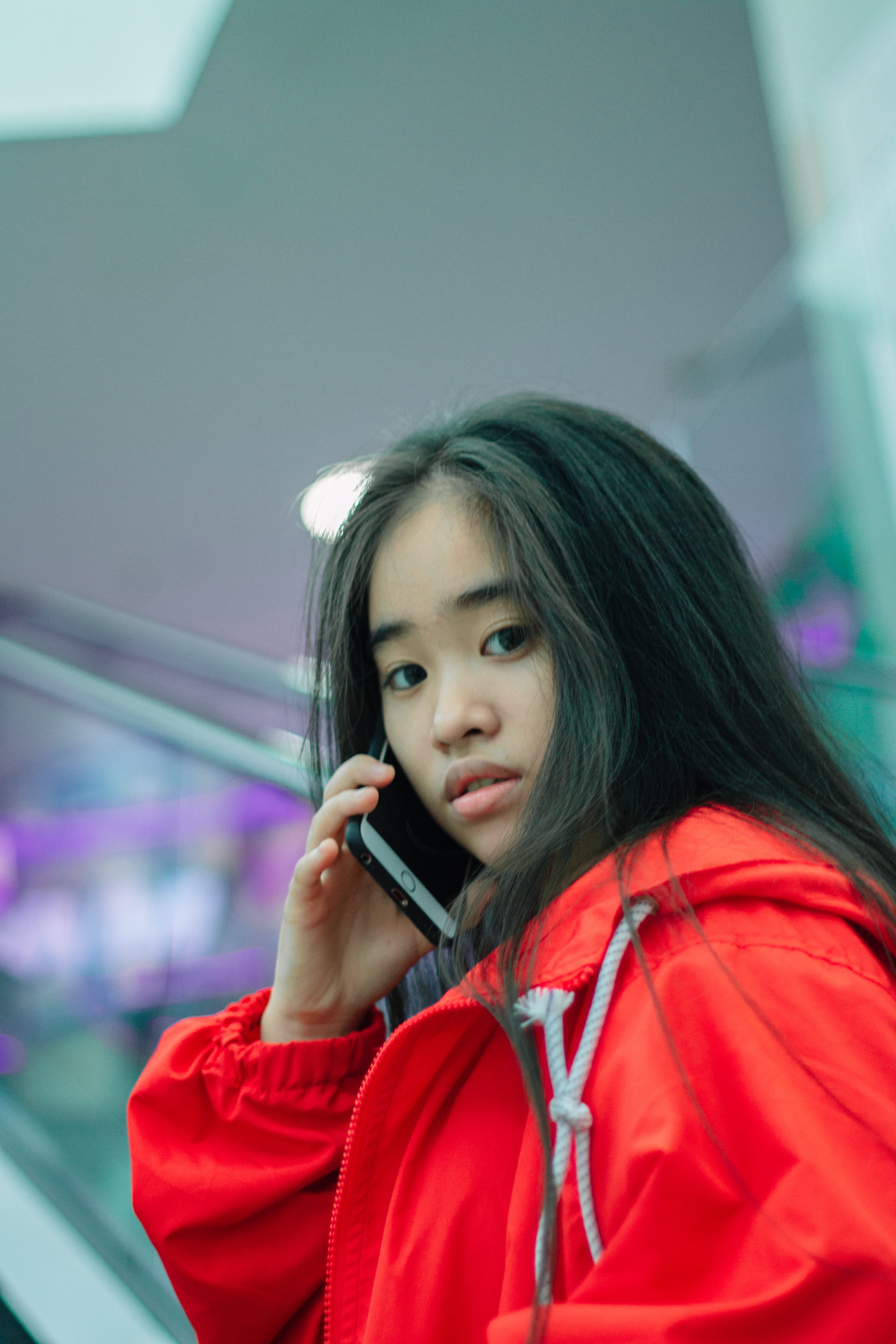 talking, indoors, brunette, hairstyle, close-up, calling, casual clothing, red jacket, pretty, front view, girl, smartphone, jacket, one person, leisure activity, Phone HD Wallpaper
