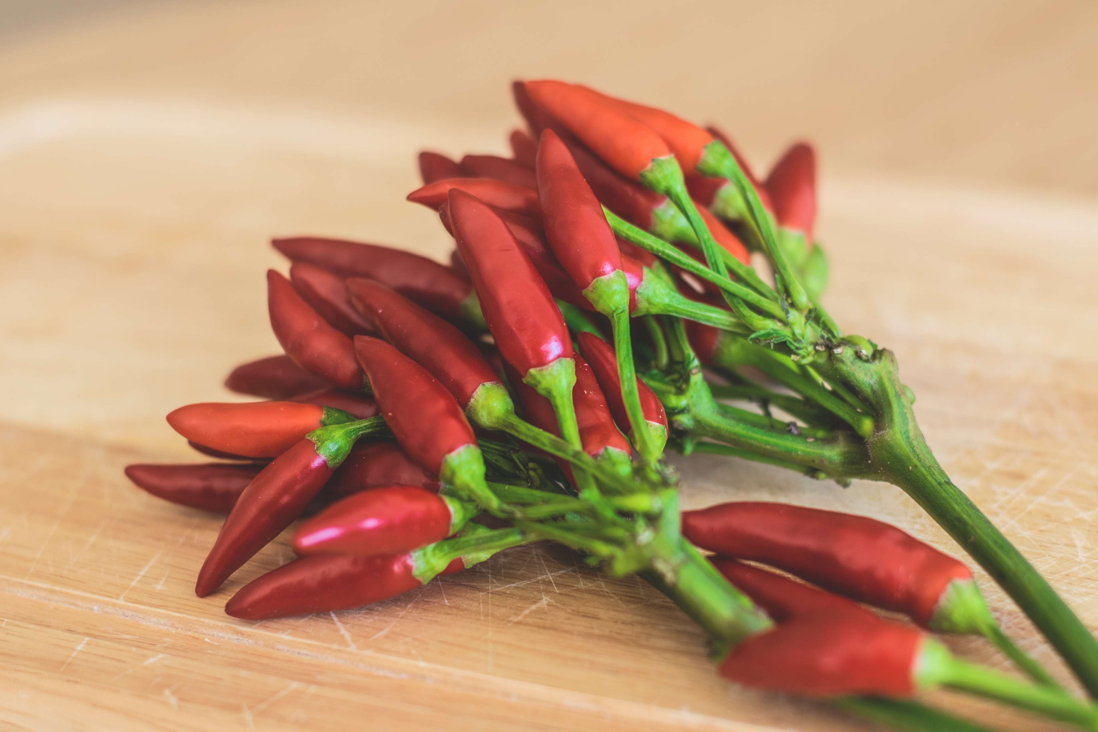 table, wellbeing, bunch, cayenne, wood - material, capsicum, spicy, focus on foreground, indoors, wood, taste, close up, grow, vegetable, 4K, food, freshness, HD Wallpaper
