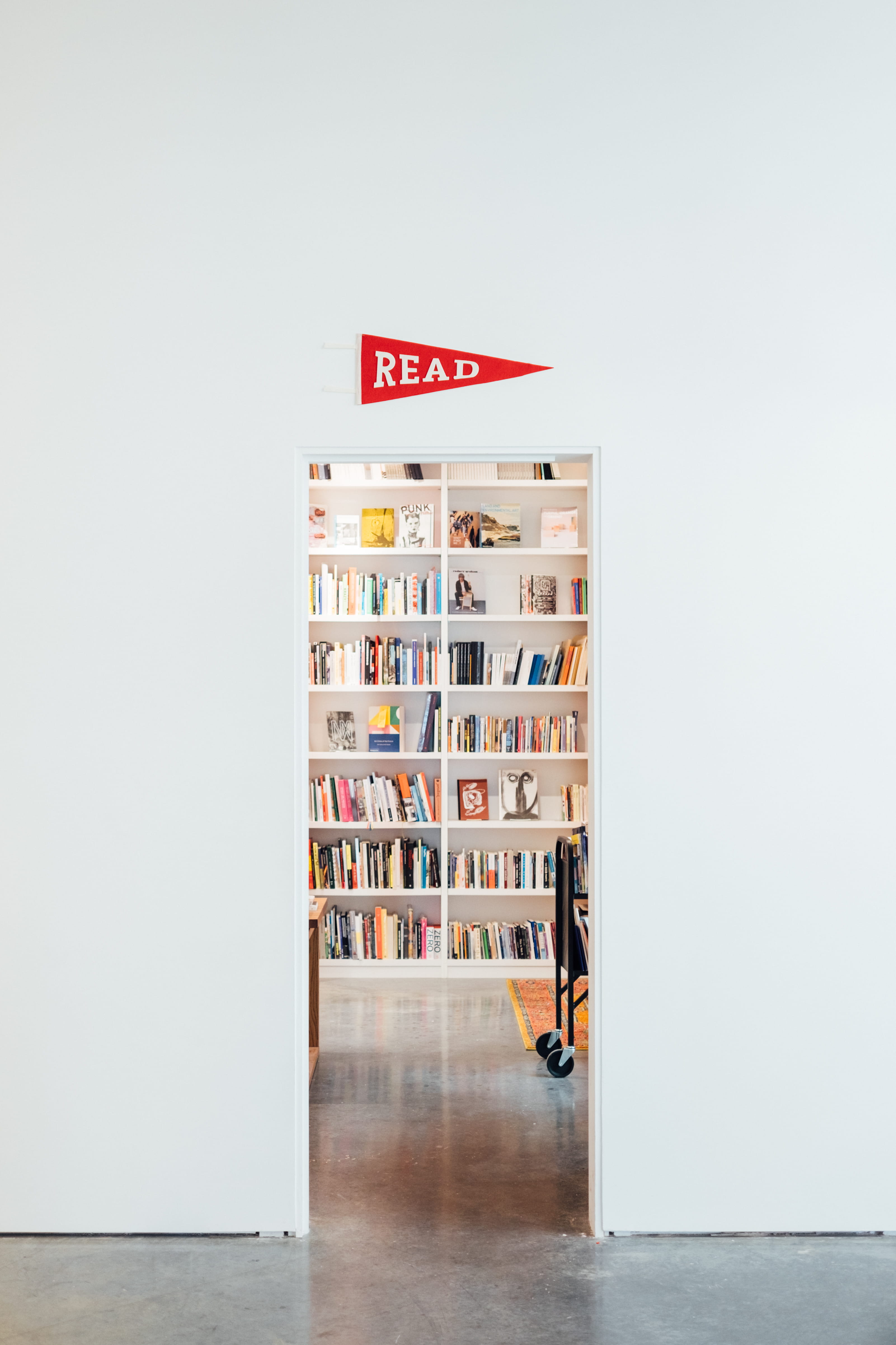 red flag, reading, desk, table, portrait, learning, books, architecture, furniture, bookshelf, business, art, white, library, 4K, flooring, interior, domestic Room, Phone HD Wallpaper
