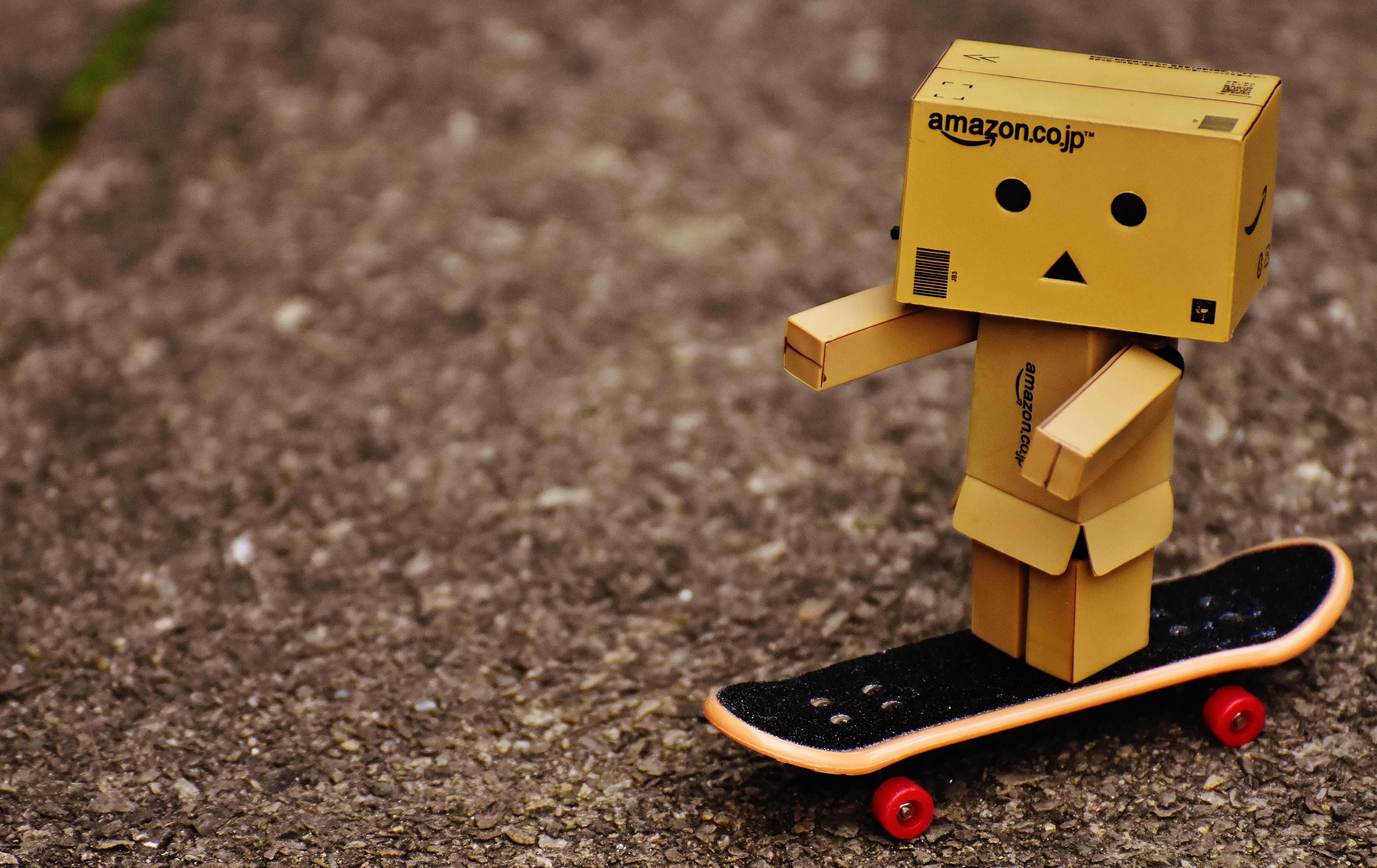 danbo, close-up, nature, creativity, industry, figure, humor, day, sweet, funny, yellow, road, human representation, skateboard, 5K, focus on foreground, HD Wallpaper