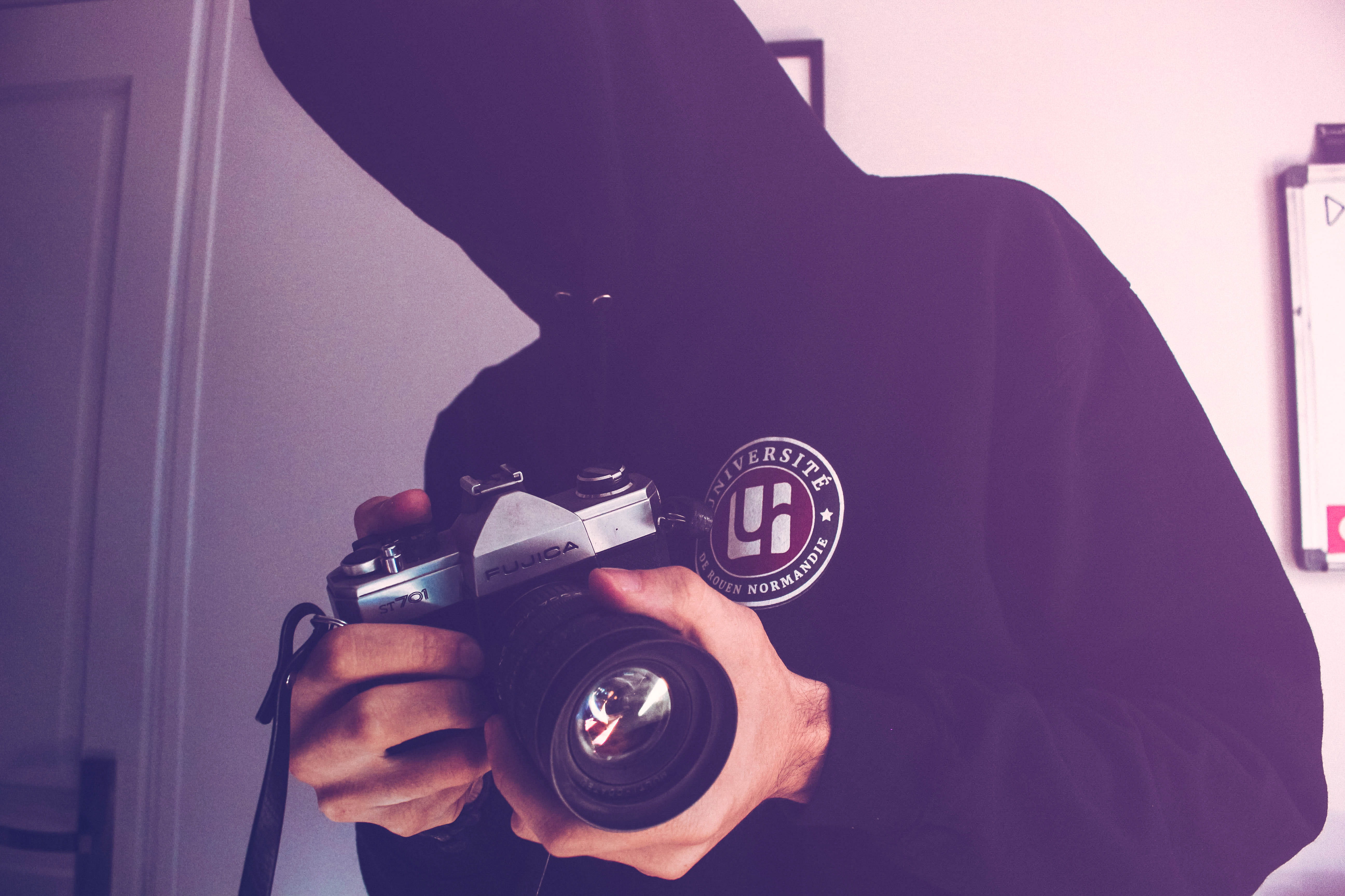 standing, occupation, wall, holding, black, camera - photographic equipment, lens, photography themes, room, photographing, technology, close -up, young adult, HD Wallpaper