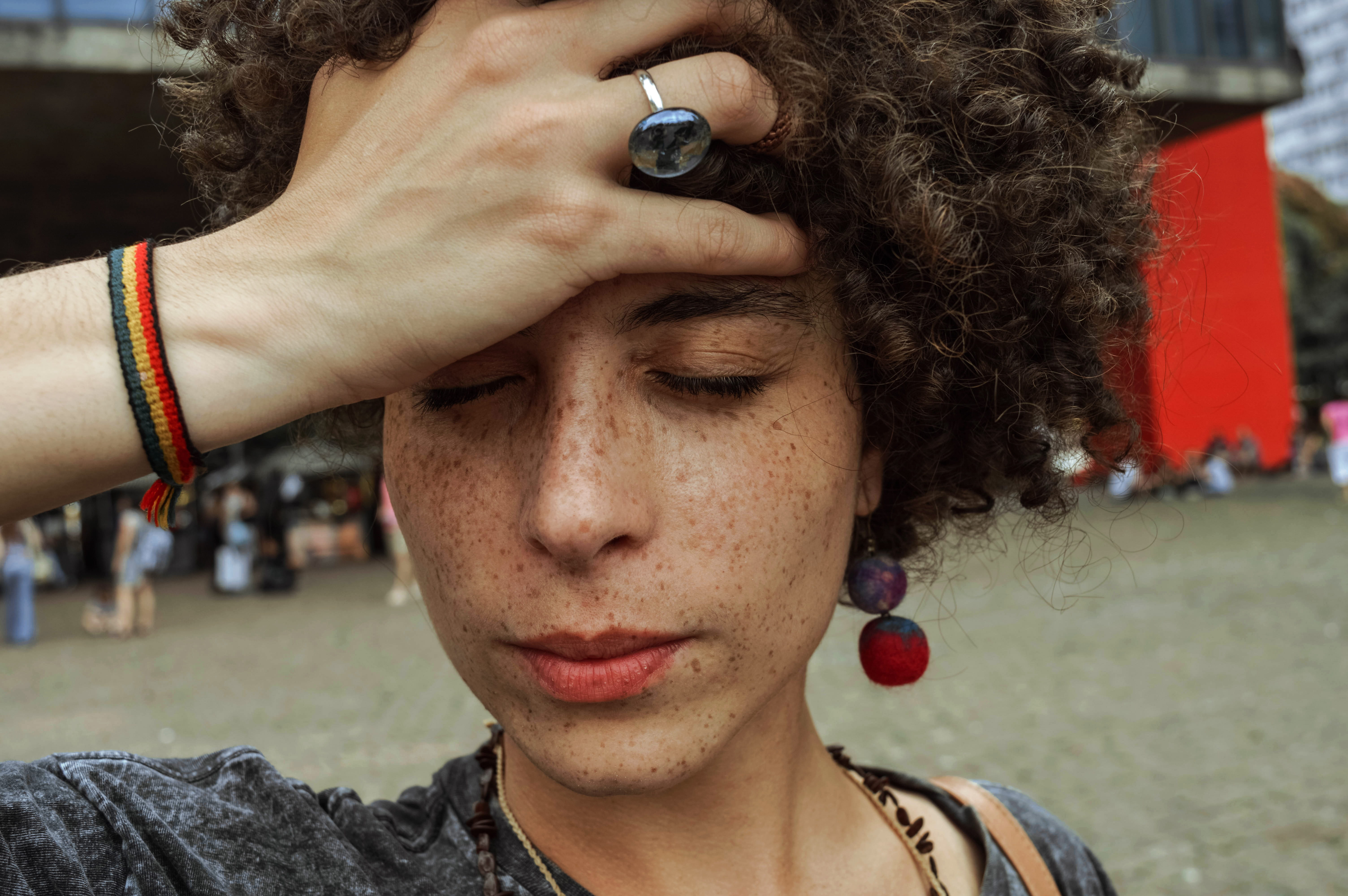 adult, holding, brunette, human face, photo, woman, forehead, jewelry, portrait, close-up, young adult, headache, leisure activity, young women, outdoors, HD Wallpaper