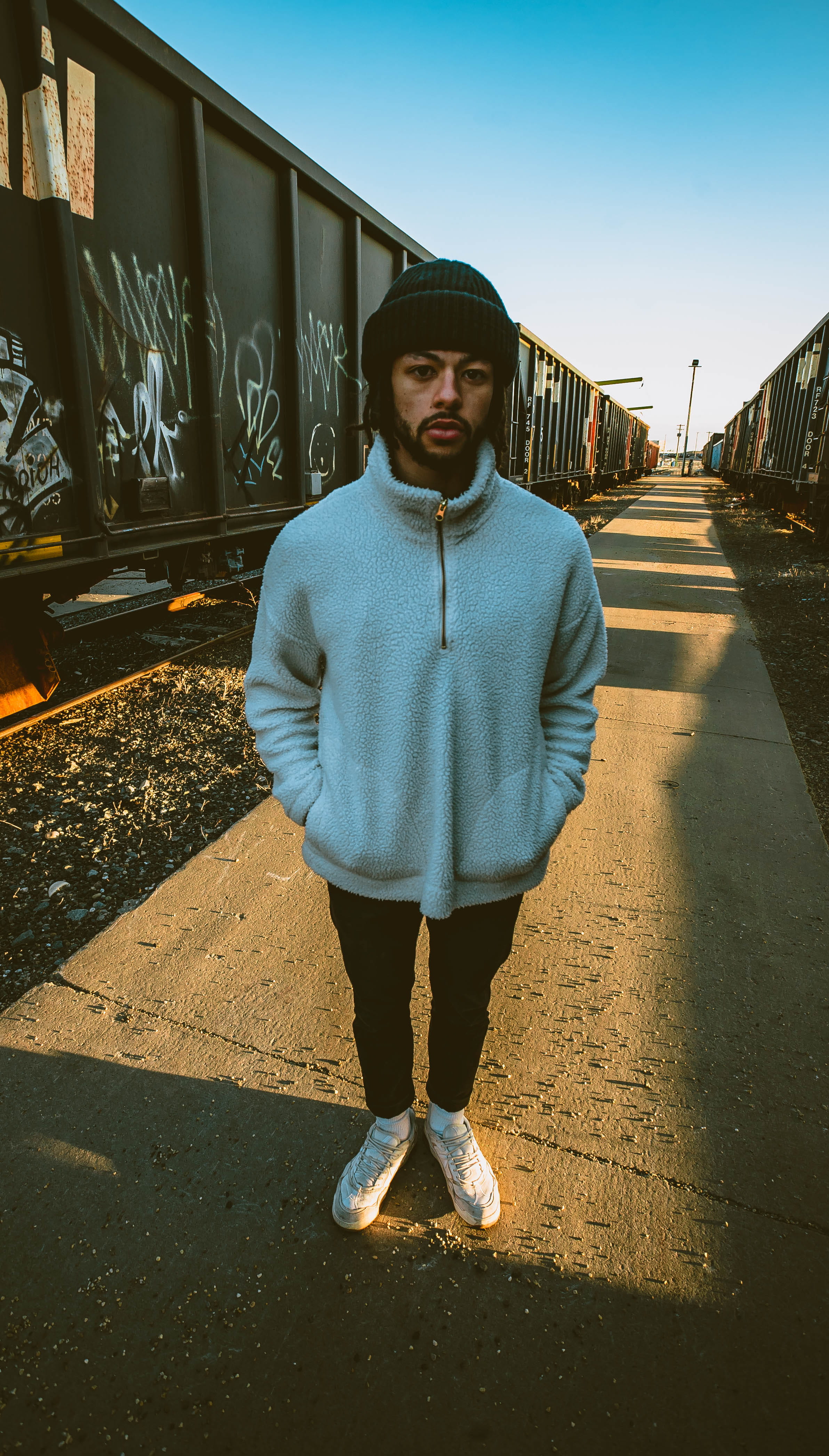 leisure activity, man, clothing, hat, human, lifestyle, sky, looking at camera, front view, architecture, out doors, shadow, trains, day, standing, portrait, Phone HD Wallpaper