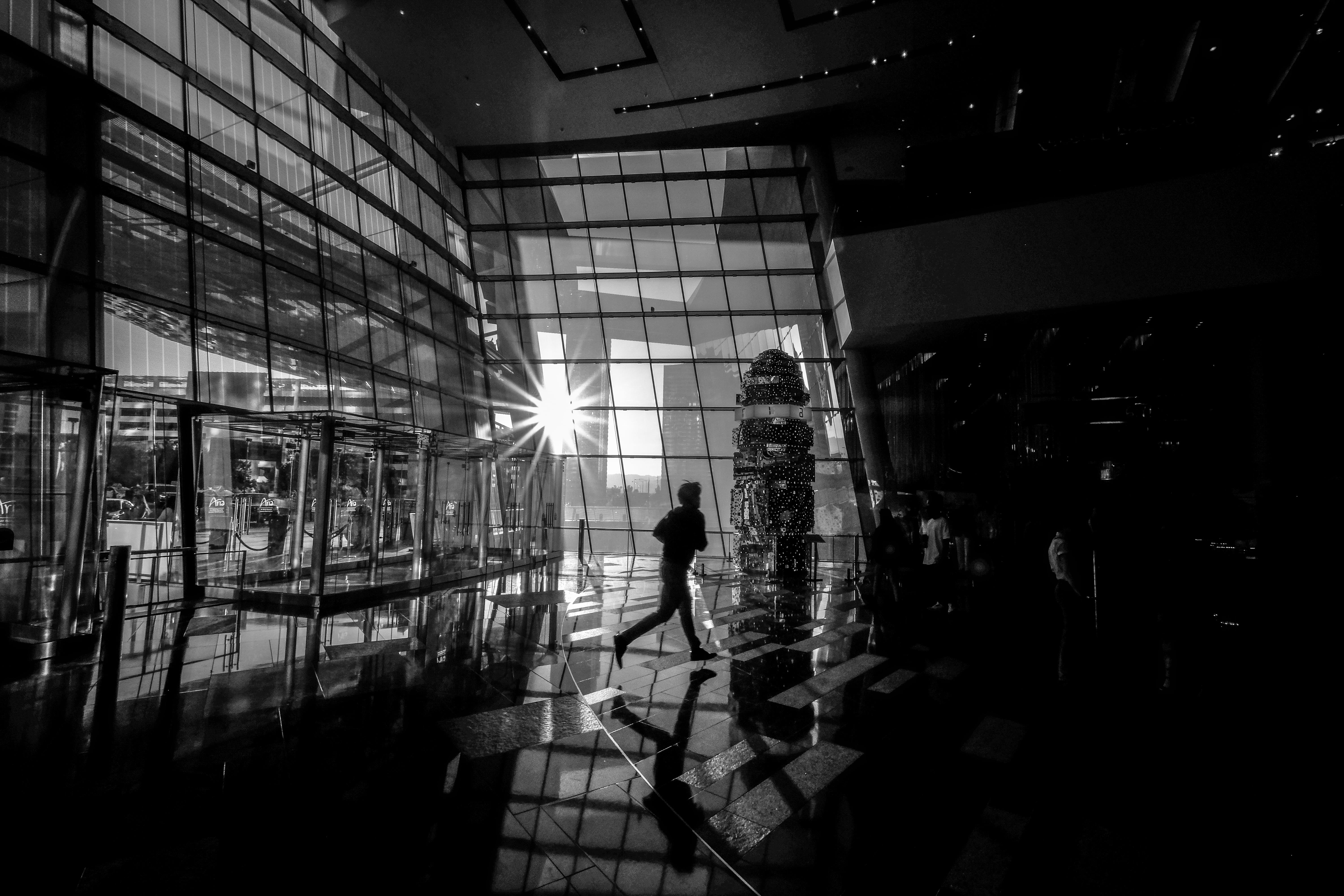 silhouette, standing, building, lighting, transportation, 5K, running, city, illuminated, photo, reflect, glass, one person, motion, lifestyles, greyscale, HD Wallpaper