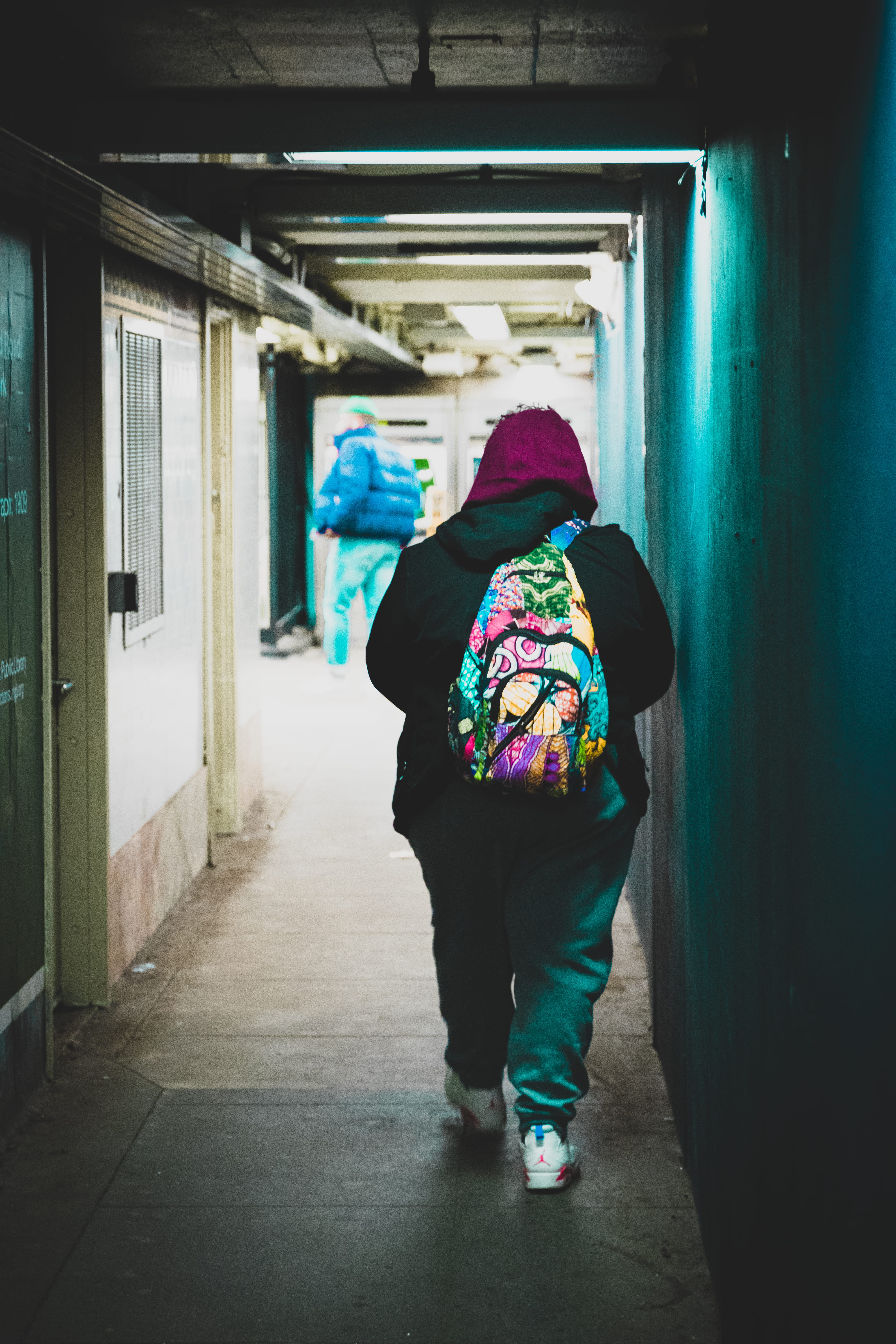 beside, rear view, hood, sleeve, corridor, purple, bag, hood - clothing, warm clothing, person, pants, hoodie, arcade, urban, real people, united states, Phone HD Wallpaper