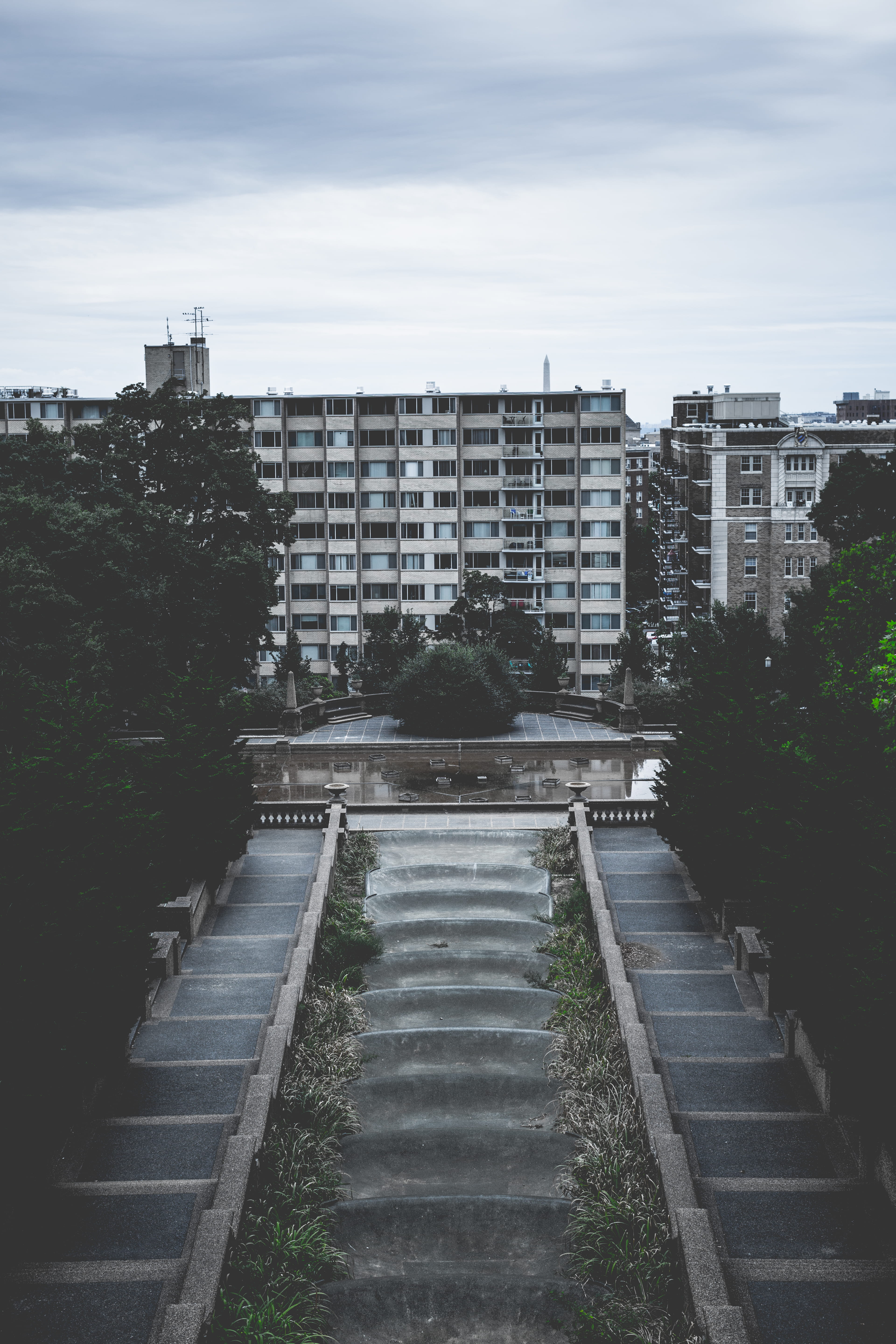 day, apartments, beside, park, hill, flats, water, built structure, structure, concrete, no people, staircase, the way forward, photo, building exterior, Phone HD Wallpaper