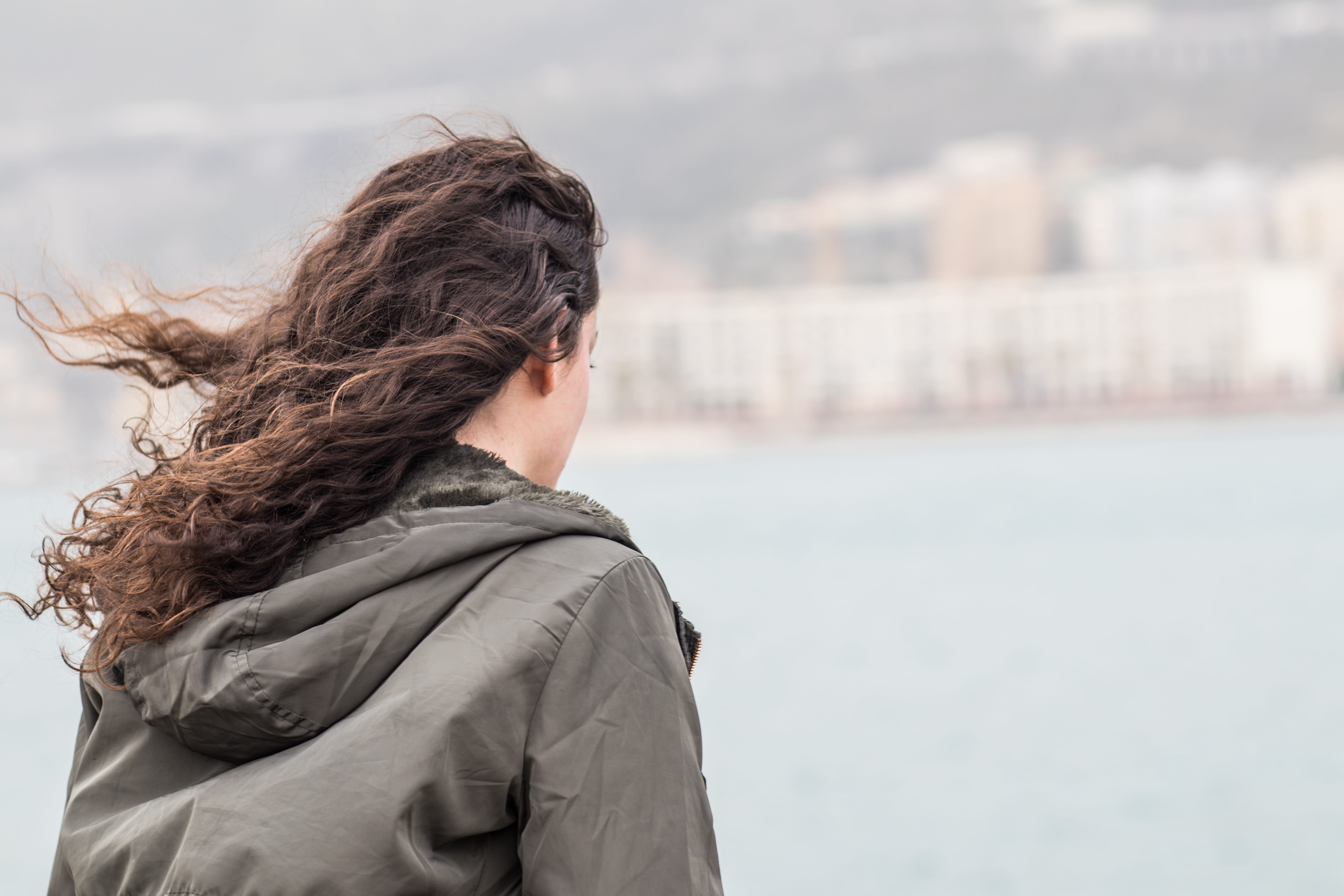 brown hair, hair, standing, adult, spontaneous, hood - clothing, focus on foreground, wind, water, leisure activity, italy, women, real people, province of salerno, HD Wallpaper
