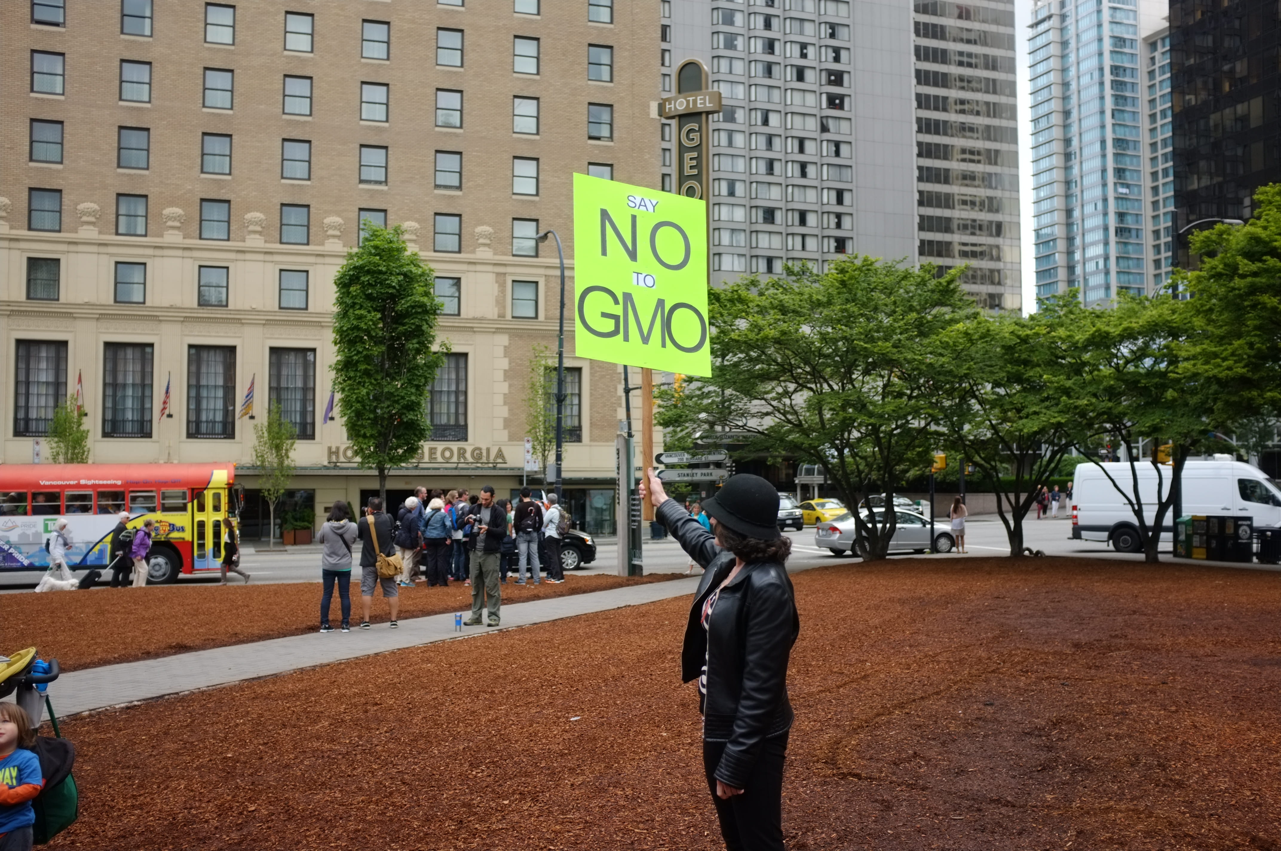 standing, street, vancouver, western script, city, gmo, sign, march, tree, women, people, 4K, incidental people, building, vancouver public library, building exterior, HD Wallpaper