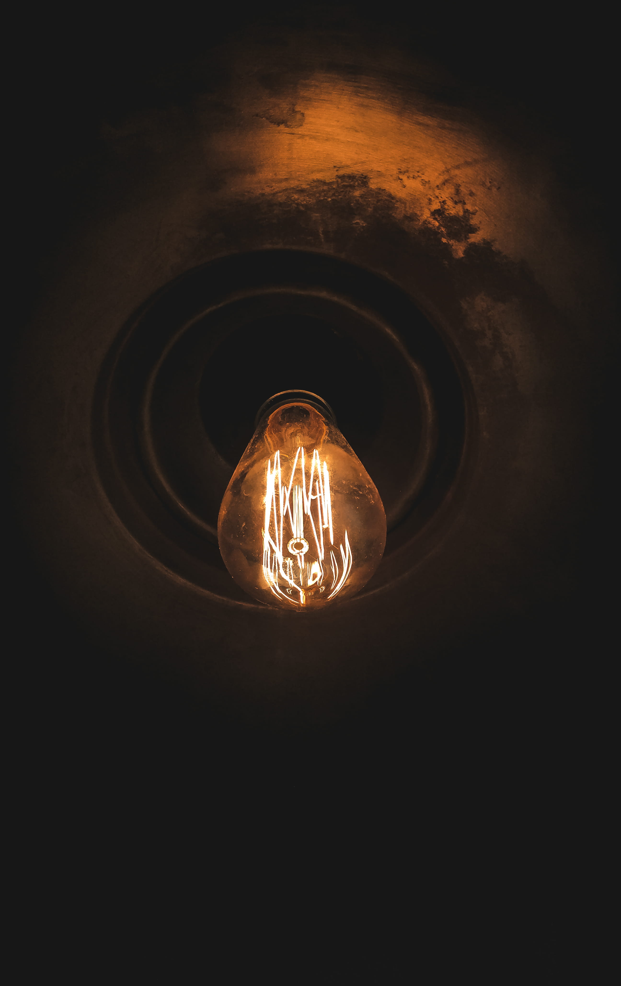 lamp, flare, sunlight, gravel, texture, pattern, indoors, glass - material, electrical equipment, close-up, electricity, lightbulb, black background, power supply, Phone HD Wallpaper