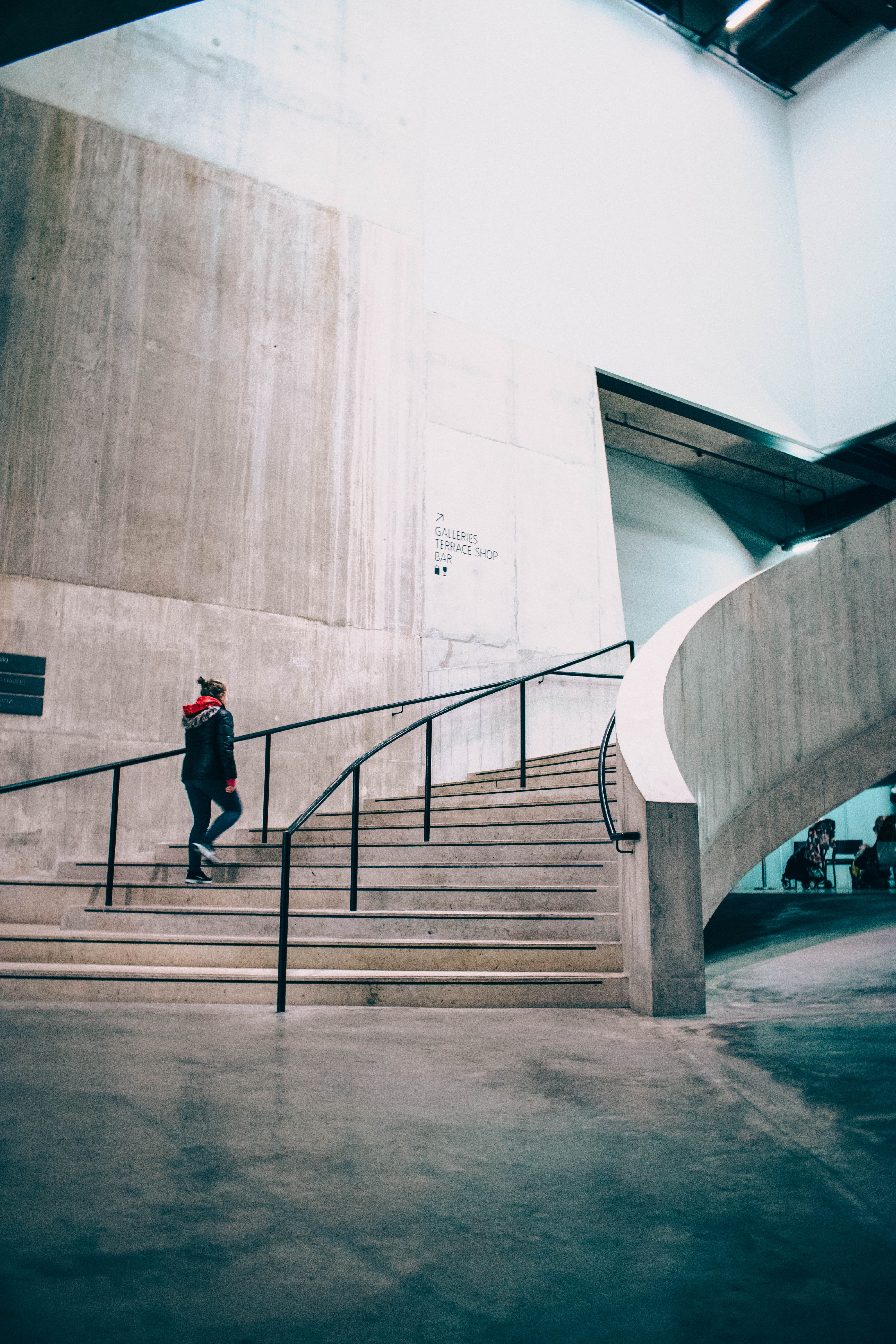 building exterior, person, outdoors, rail, real people, black, leisure activity, bridge, city, connection, rear view, adult, staircase, climbing, walking, Phone HD Wallpaper