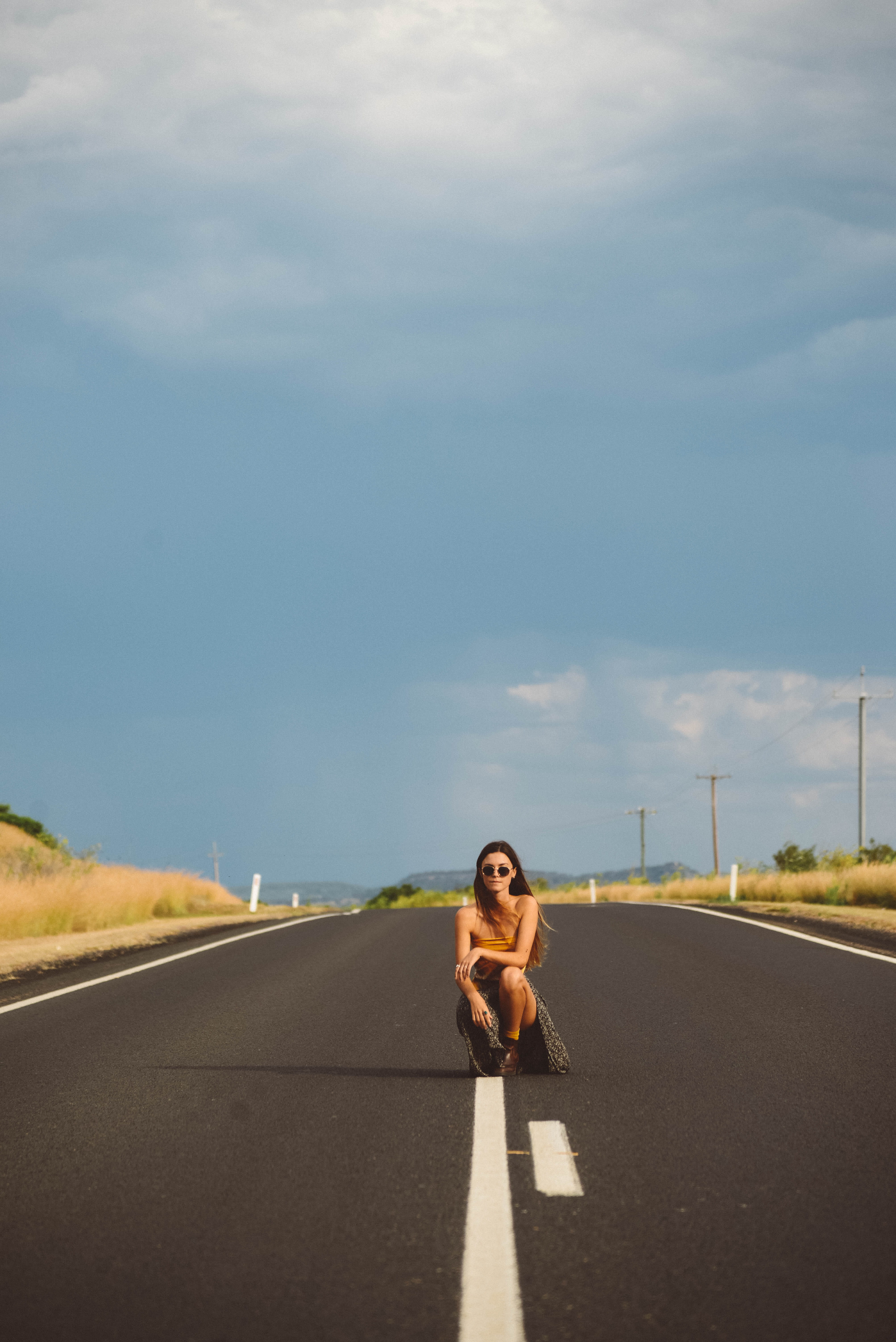 white, open, looking at camera, asphalt, sunlight, real people, casual clothing, the way forward, sign, kneeling, one person, 5K, lifestyles, fashion, Phone HD Wallpaper