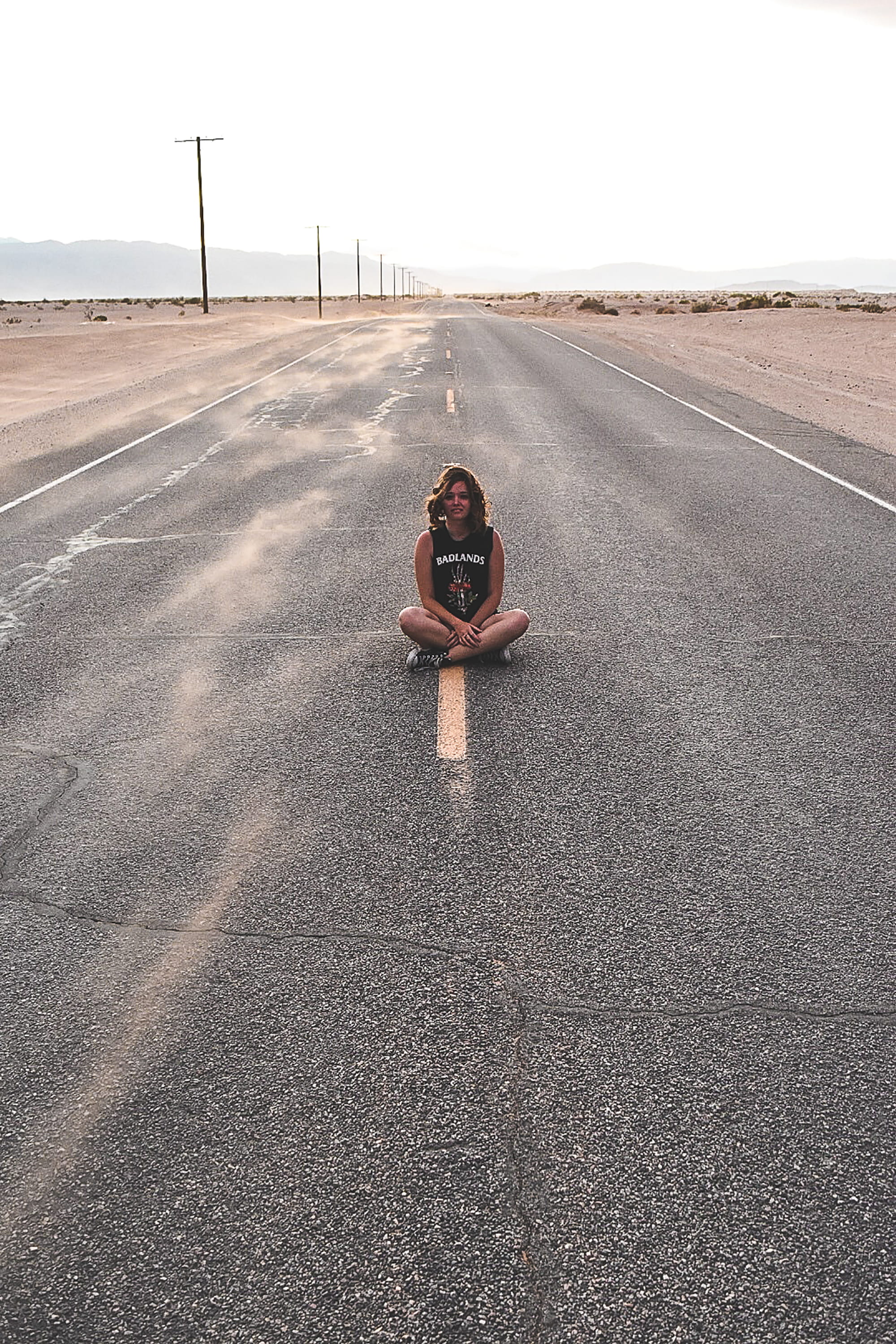 leisure activity, transportation, outdoors, looking at camera, crossed, asphalt, sitting, day, marking, yellow, portrait, symbol, sign, abandoned, full length, Phone HD Wallpaper