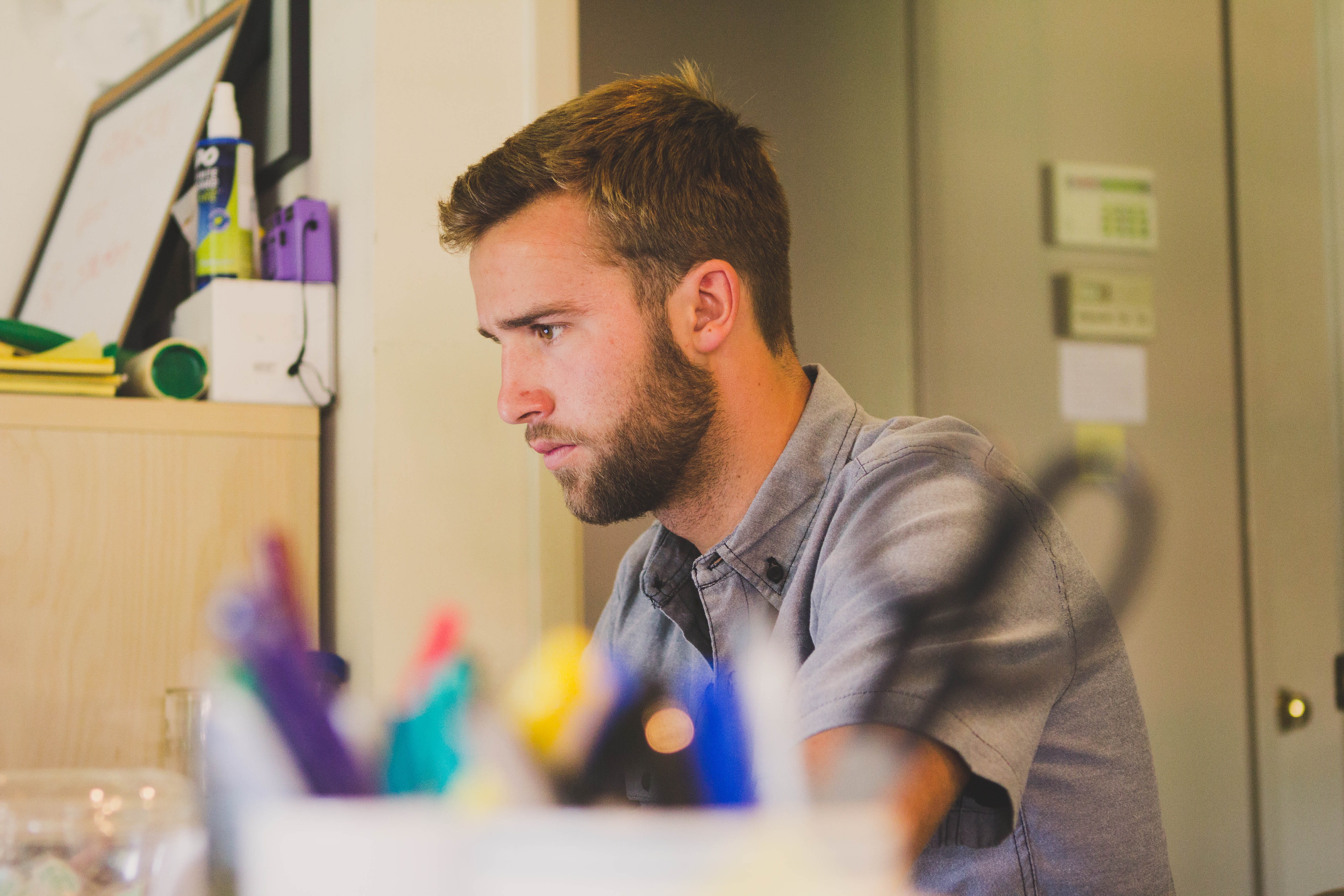 looking down, concentrated, men, young men, occupation, startup, beard, employee, working, workspace, homework, young adult, design professional, work, HD Wallpaper