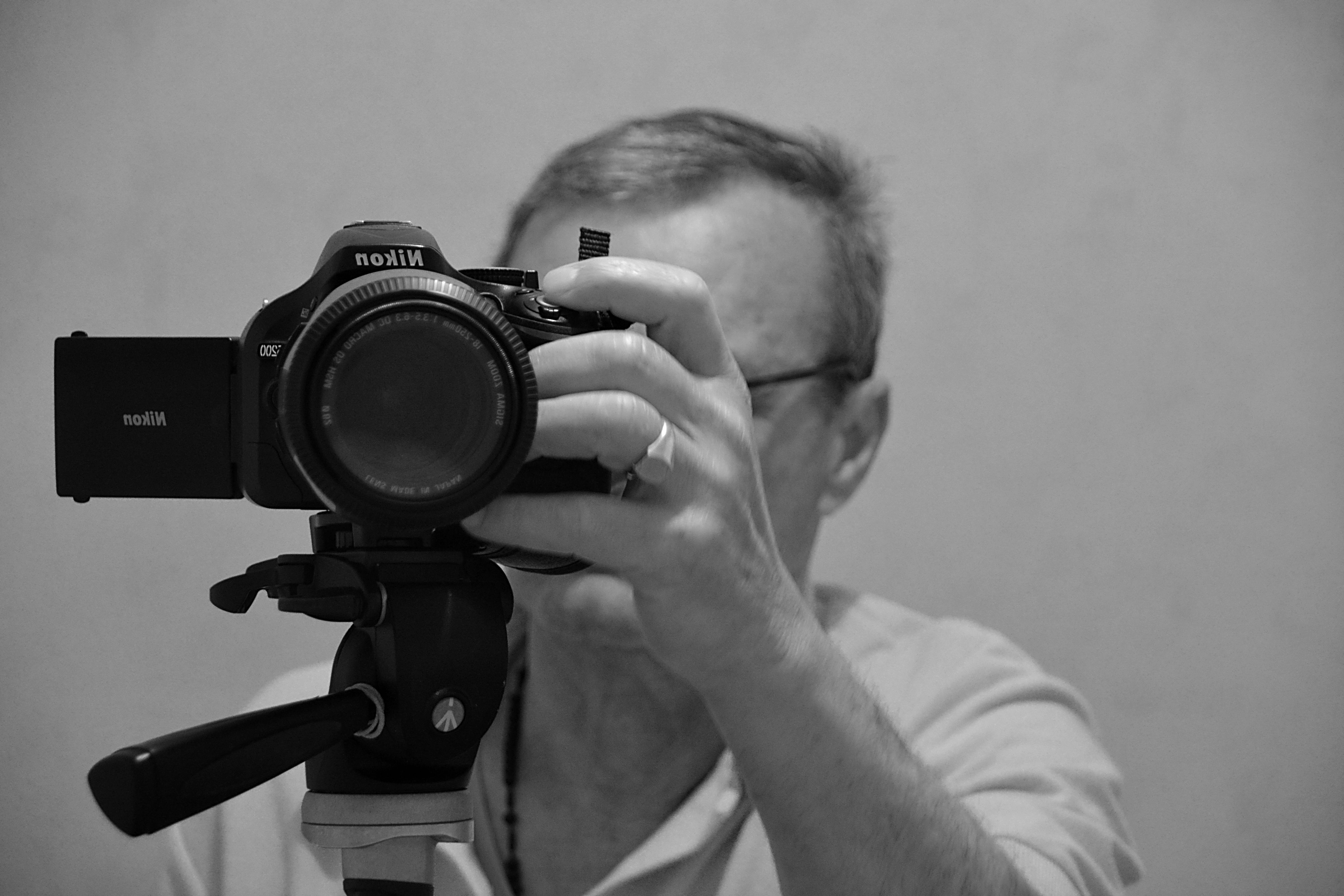 grayscale, picture, shooting, holding, objective, dslr, camera - photographic equipment, photography themes, filming, males, camera, mature adult, photographer, HD Wallpaper