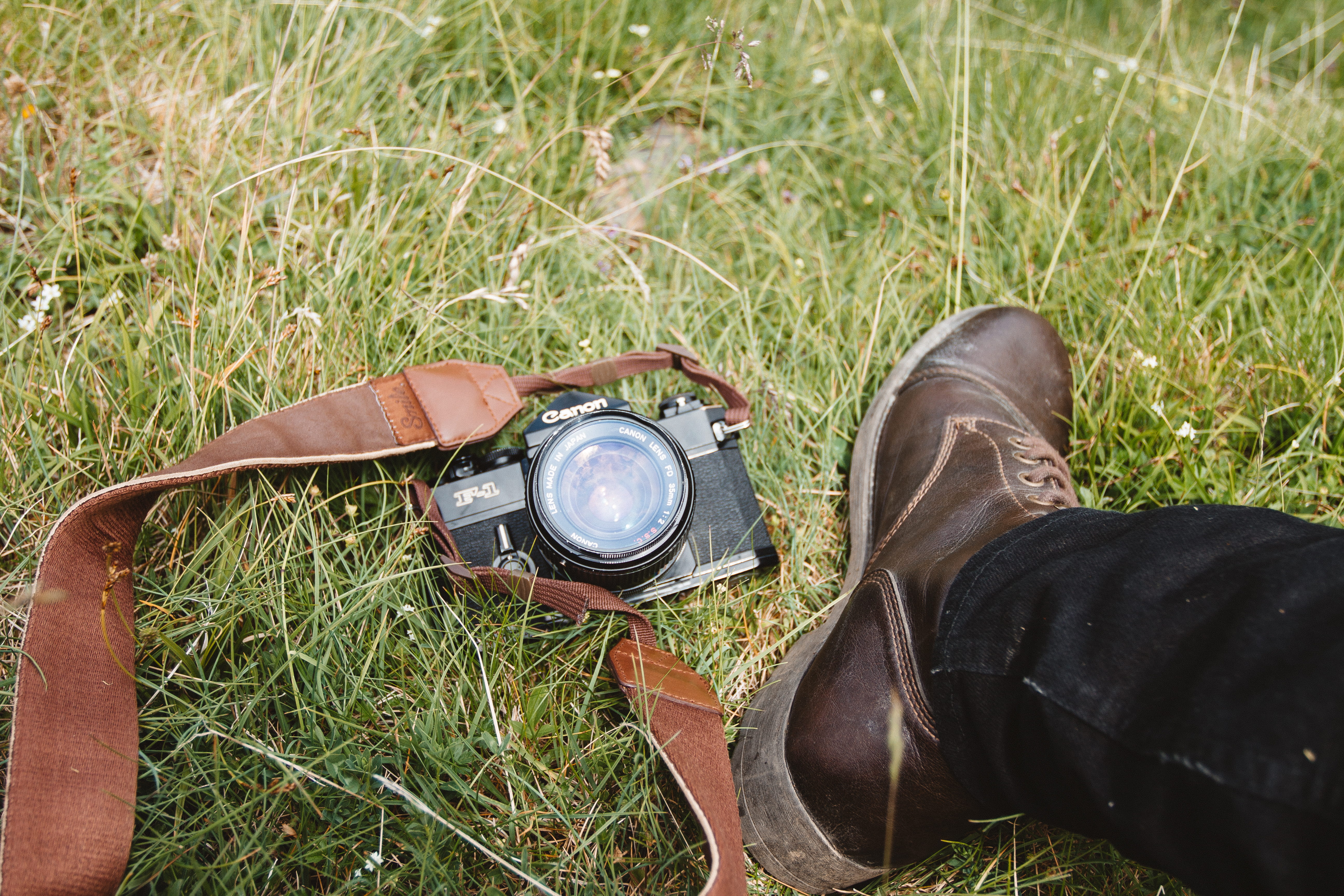 high angle view, human foot, plant, old-fashioned, outdoors, shoe, one person, personal perspective, human body part, green color, grass, Canon F1, lifestyles, HD Wallpaper