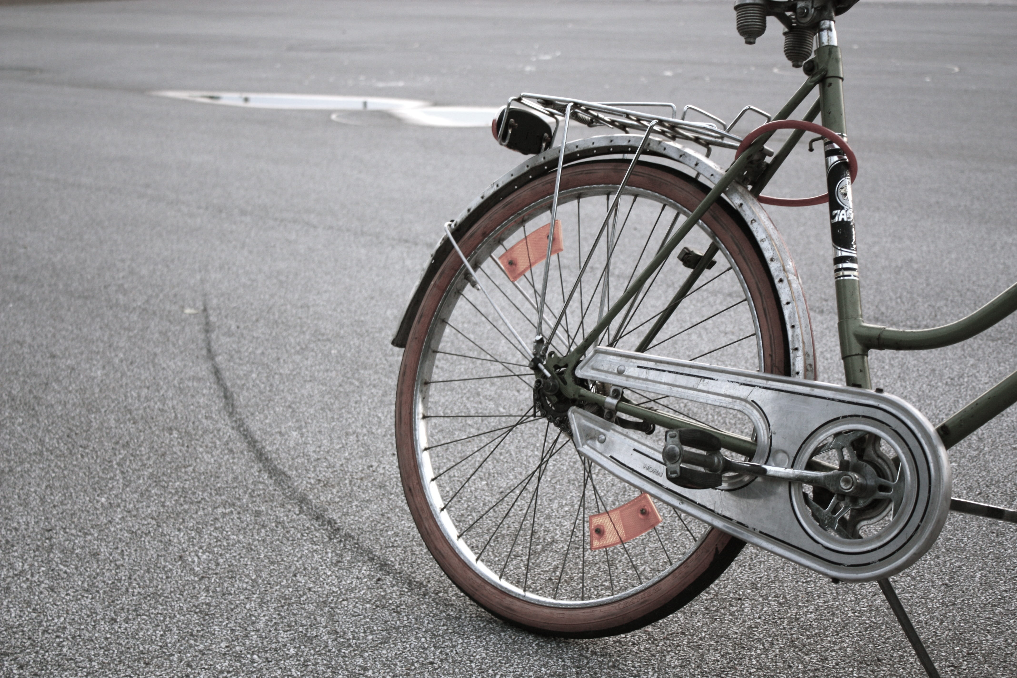 bicycles, day, bike, wheel, basket, biker, locomotion, mode of transportation, skid mark, focus on foreground, gray, road, no people, high angle view, sport, HD Wallpaper