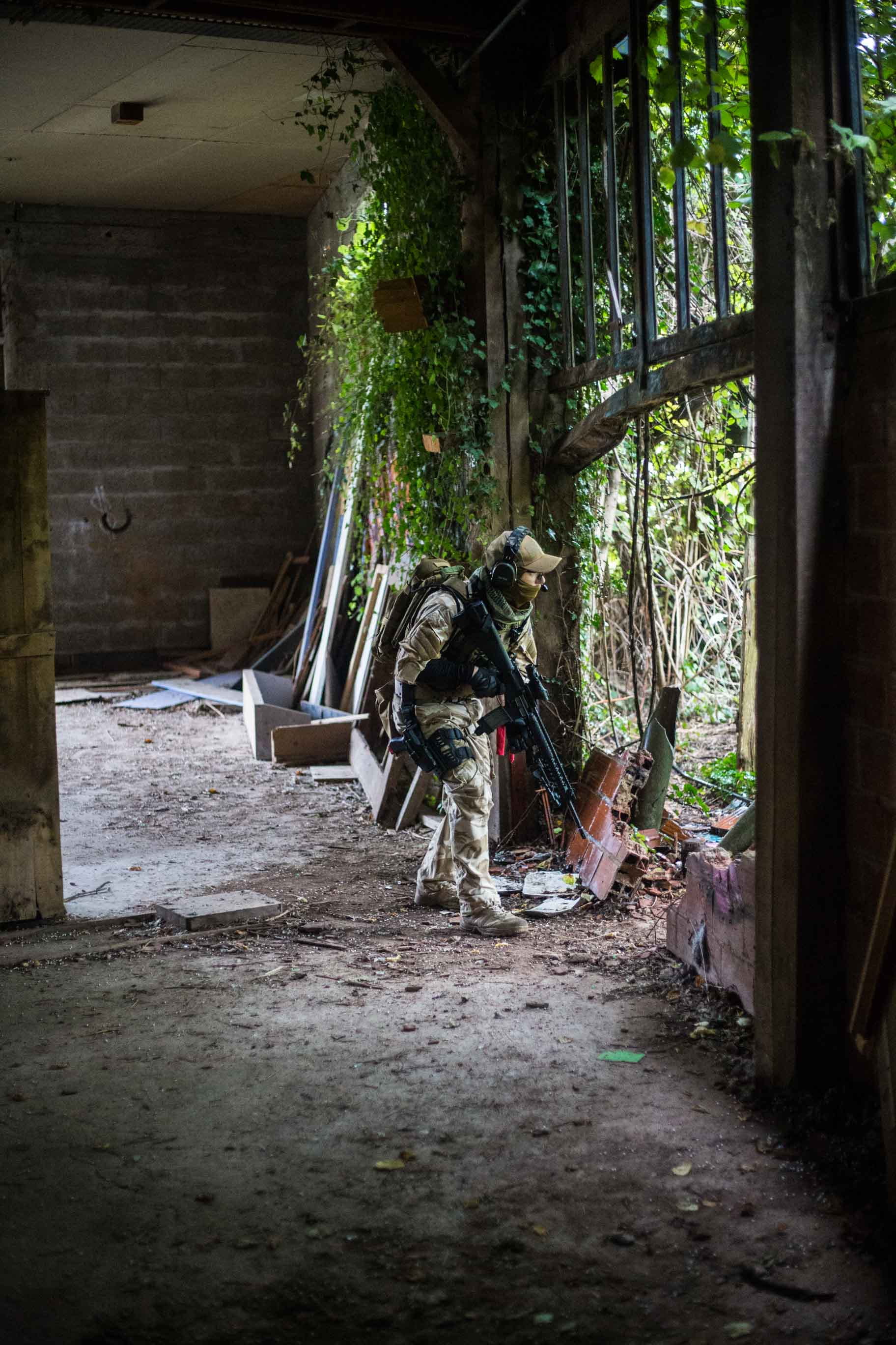 forest, man, paintball, obsolete, bad condition, outside, bricks, abandoned, deterioration, day, airsoft, building, rifle, architecture, armored, black, Phone HD Wallpaper
