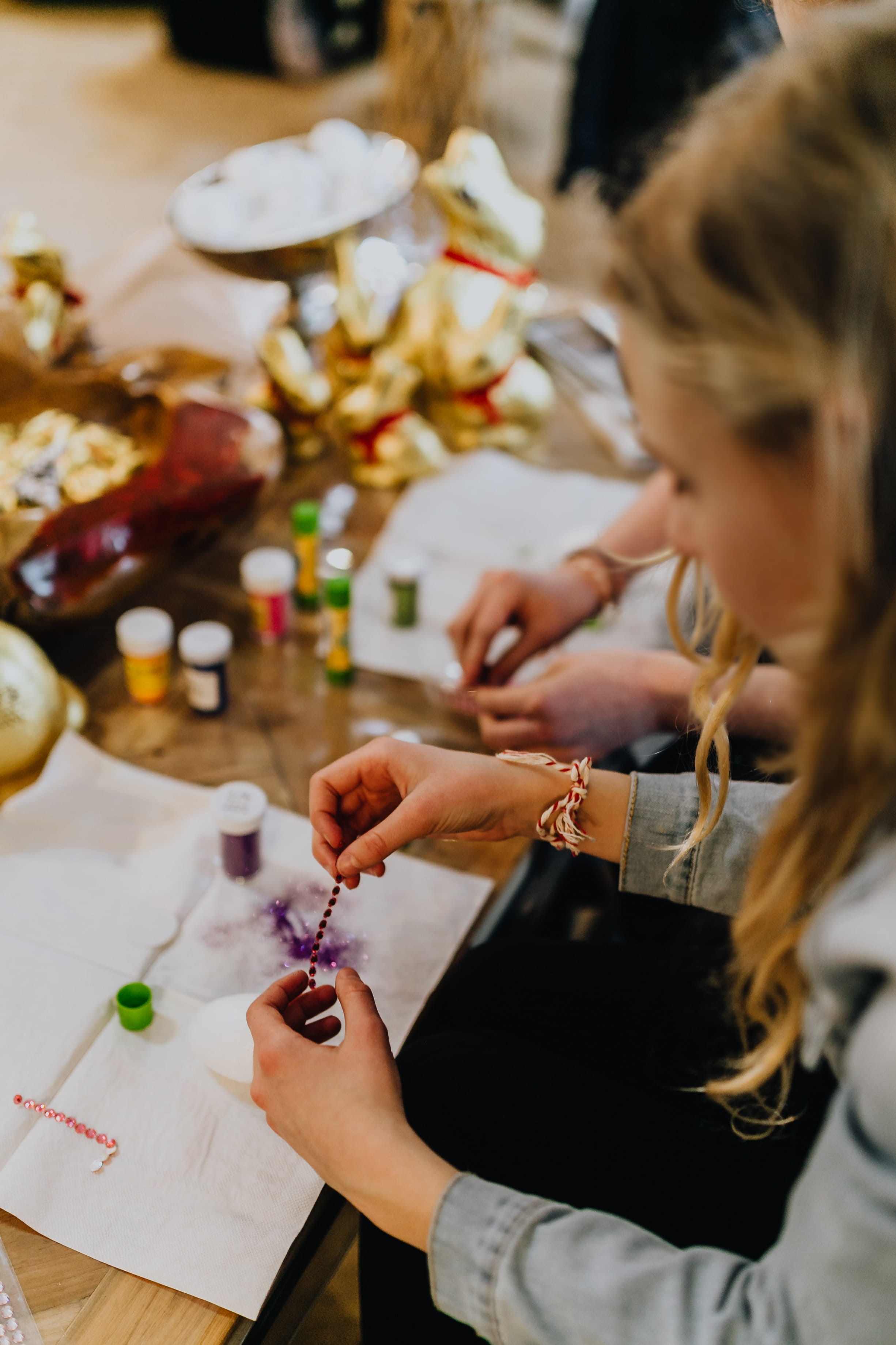 occupation, selective focus, decorating, table, art and craft, craft, real people, coloring, women, painting, eggs, easter eggs, indoors, skill, young women, Phone HD Wallpaper