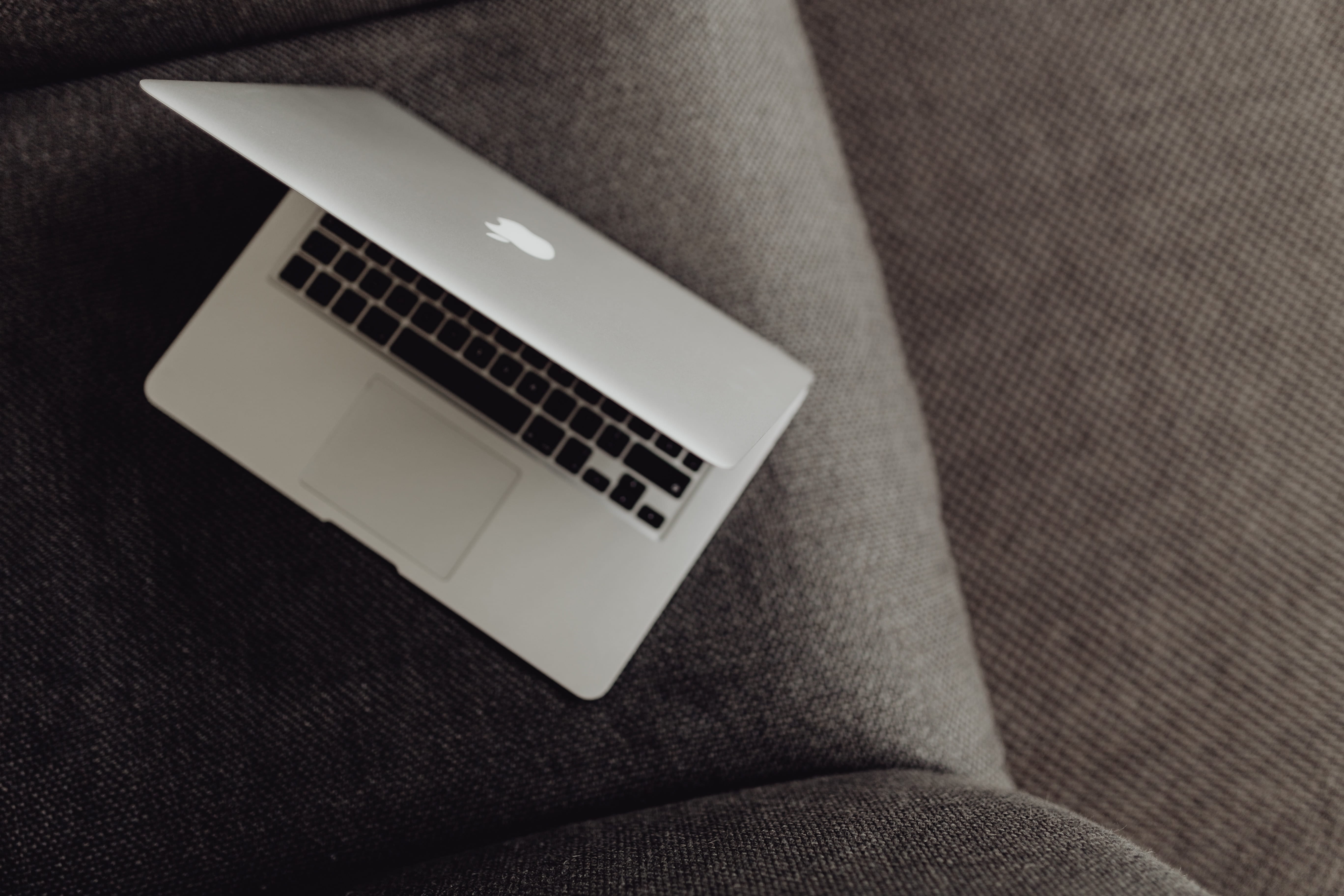 close-up, laptop, arts culture and entertainment, lying, one person, armchair, macbook, view, still life, textile, furniture, computer, grey, communication, HD Wallpaper