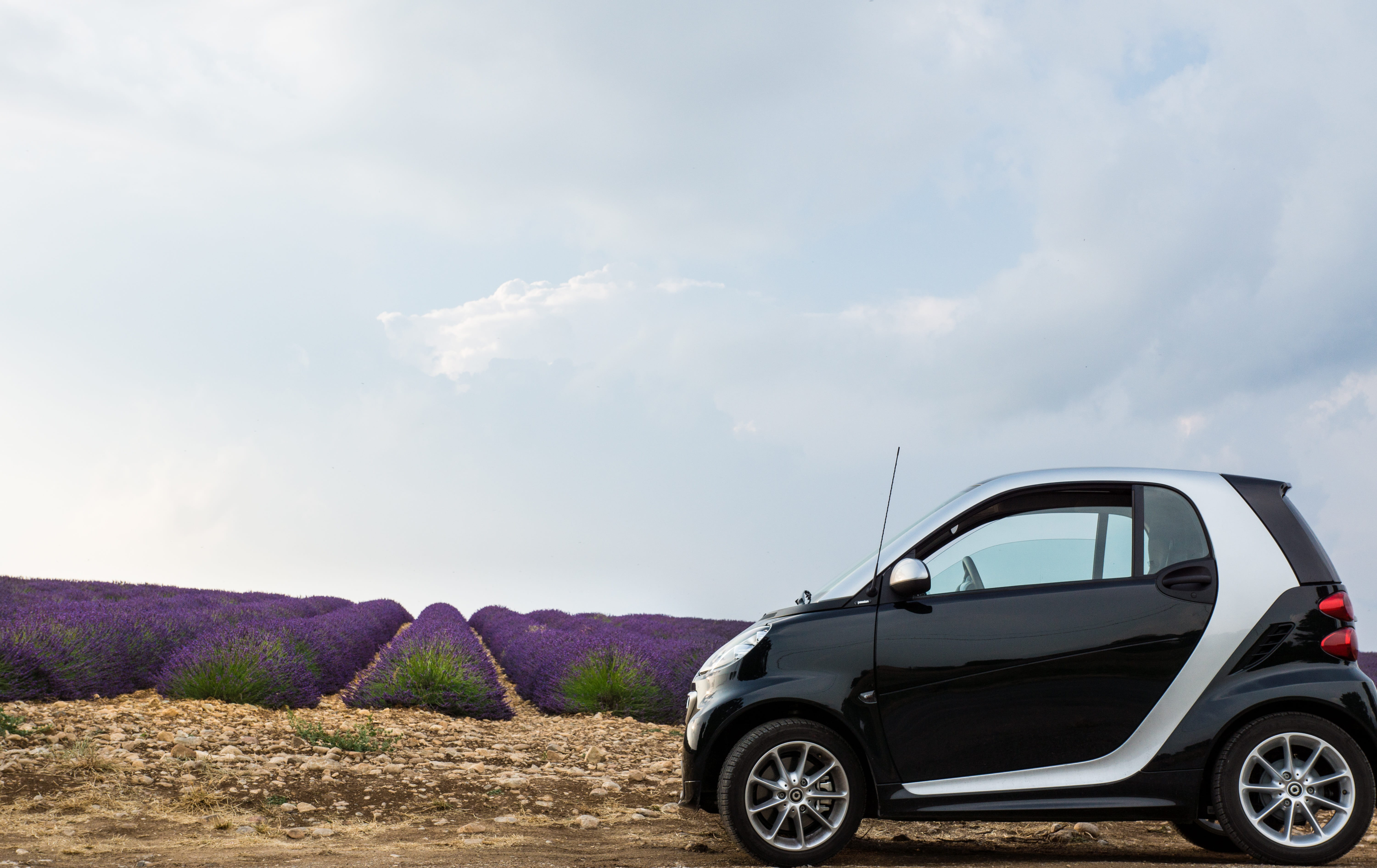 remote, hatchback, land vehicle, provence, cloud - sky, landscape, sky, rural scene, environment, smart, outdoors, silver, road trip, 5K, non-urban scene, HD Wallpaper