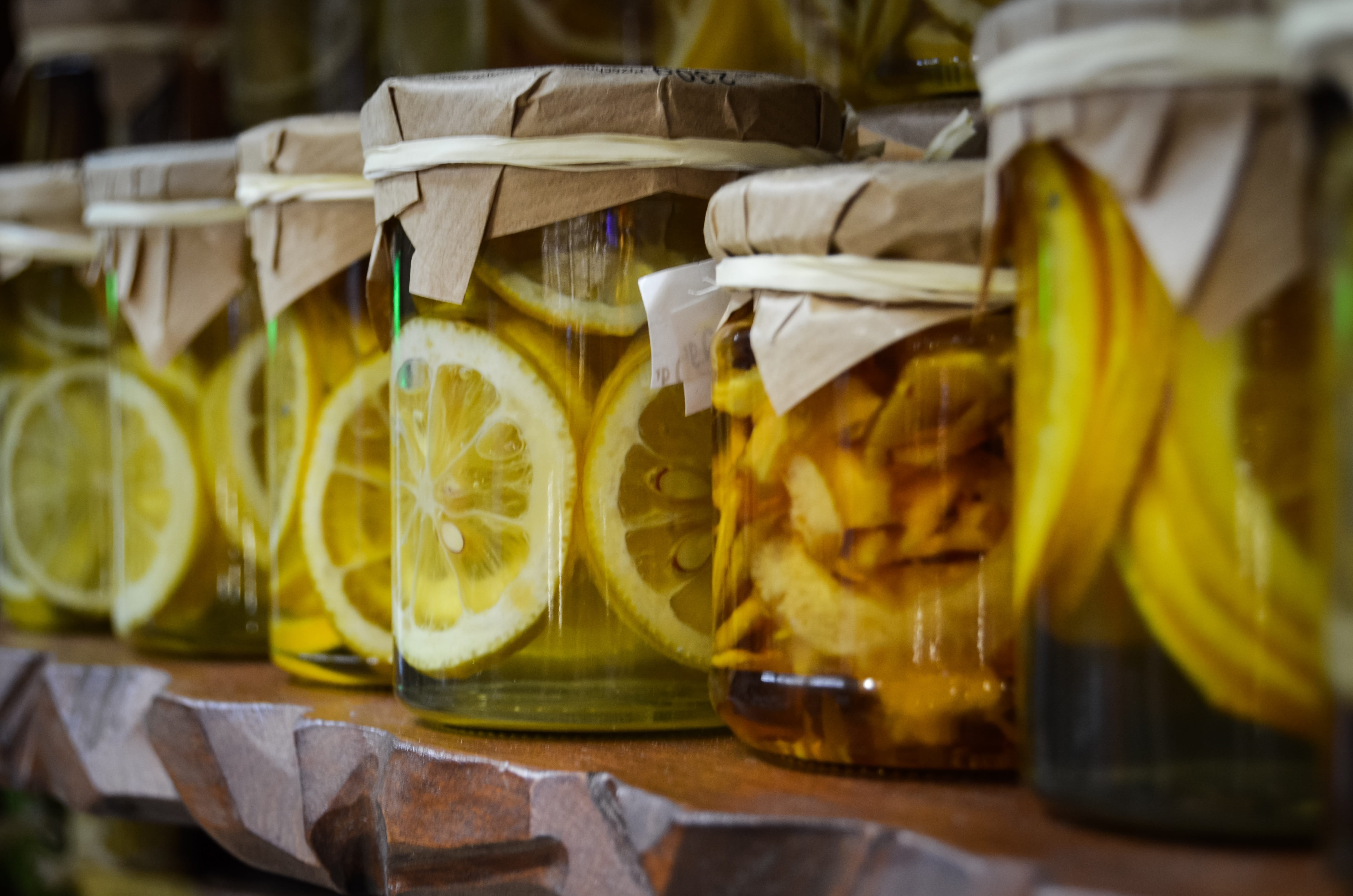 small group of objects, in a row, indoors, lemon, no people, drink, food, container, jars, yellow, multi colored, refreshment, paper, slice, natural food, HD Wallpaper
