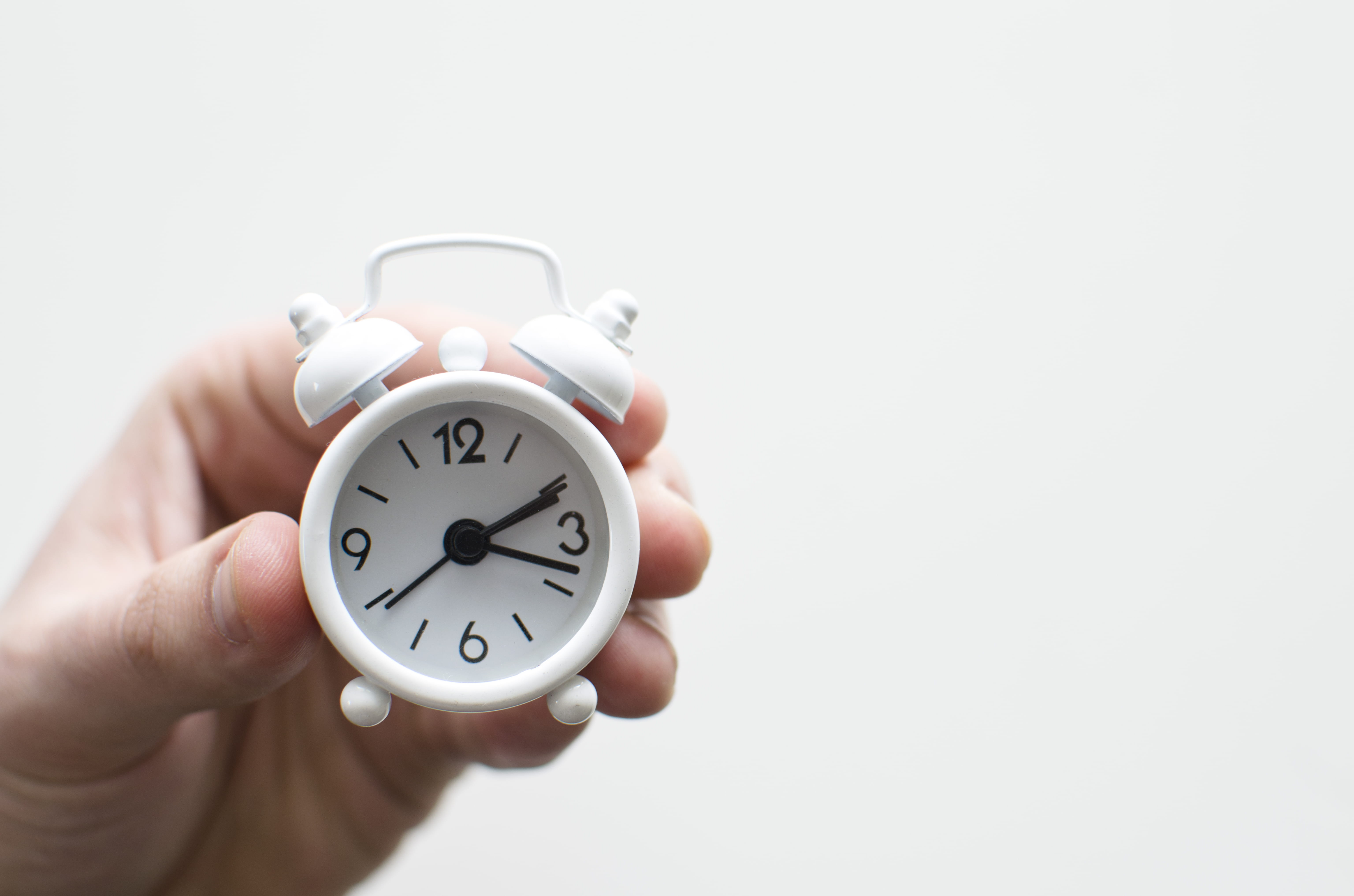 Alarm clock, copy space, 5K, hour, minute, single Object, bell, clock, white background, person, cut out, alarm, mini, number, studio shot, indoors, human Hand, HD Wallpaper