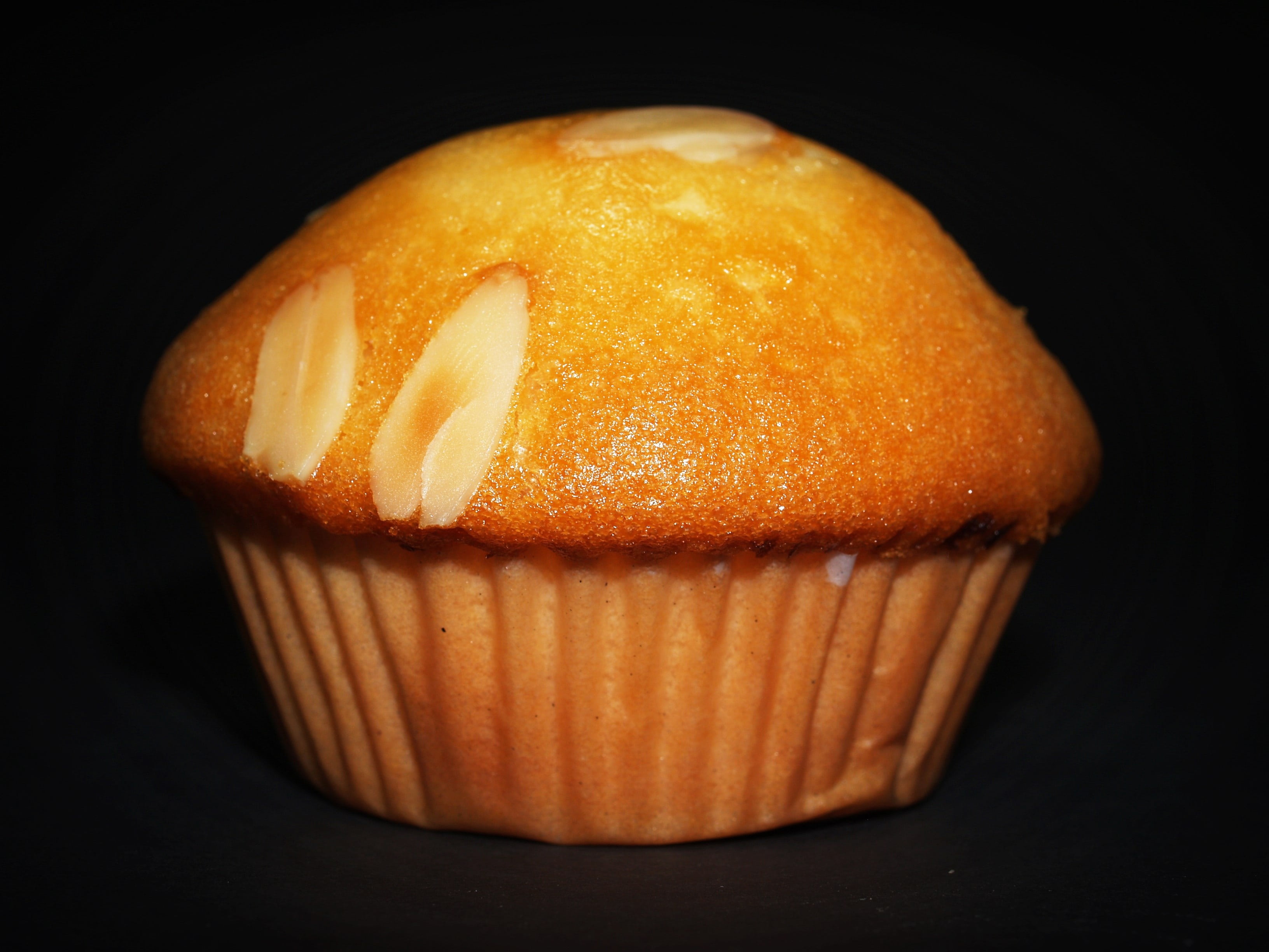 studio shot, bakery, no people, nobody, dessert, muffin, orange color, iced, lots, sweet, 2K, dark, cup-cake, multi-colored, black background, selection, HD Wallpaper