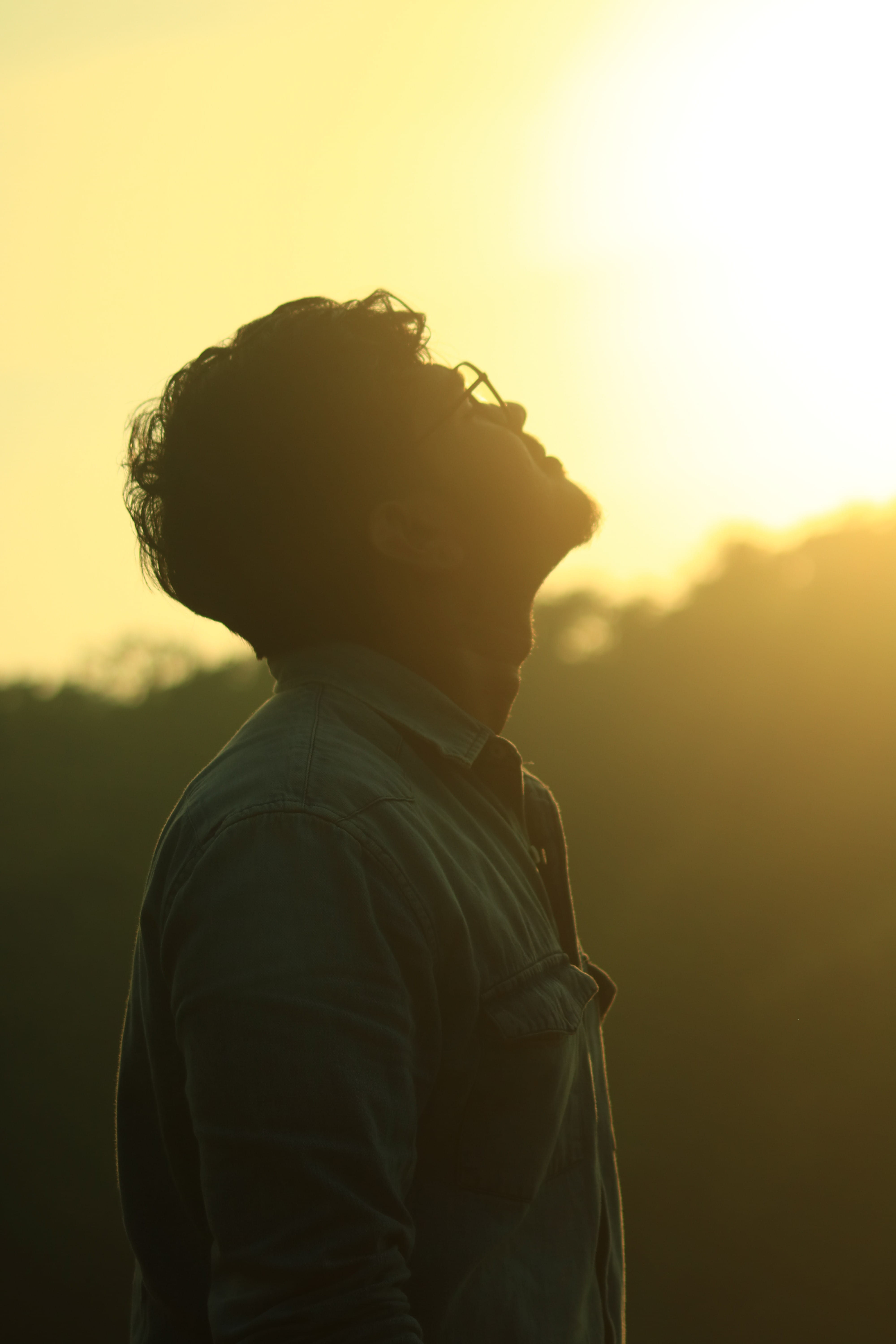 one person, young men, backlit, dawn, 5K, leisure activity, bright, nature, guy, waist up, sunset, contemplation, focus, profile view, looking up, male, Phone HD Wallpaper