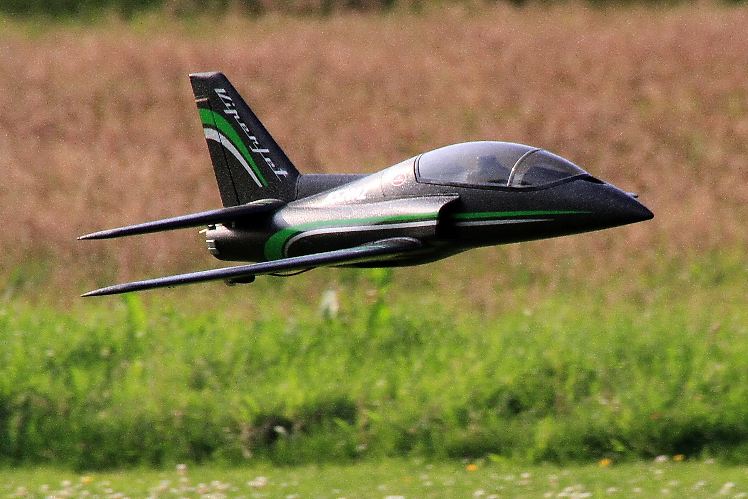 absence, focus on foreground, viper jet, grass, c, outdoors, plant, 2K, growth, model flight, selective focus, no people, r, air vehicle, metal, side view, HD Wallpaper