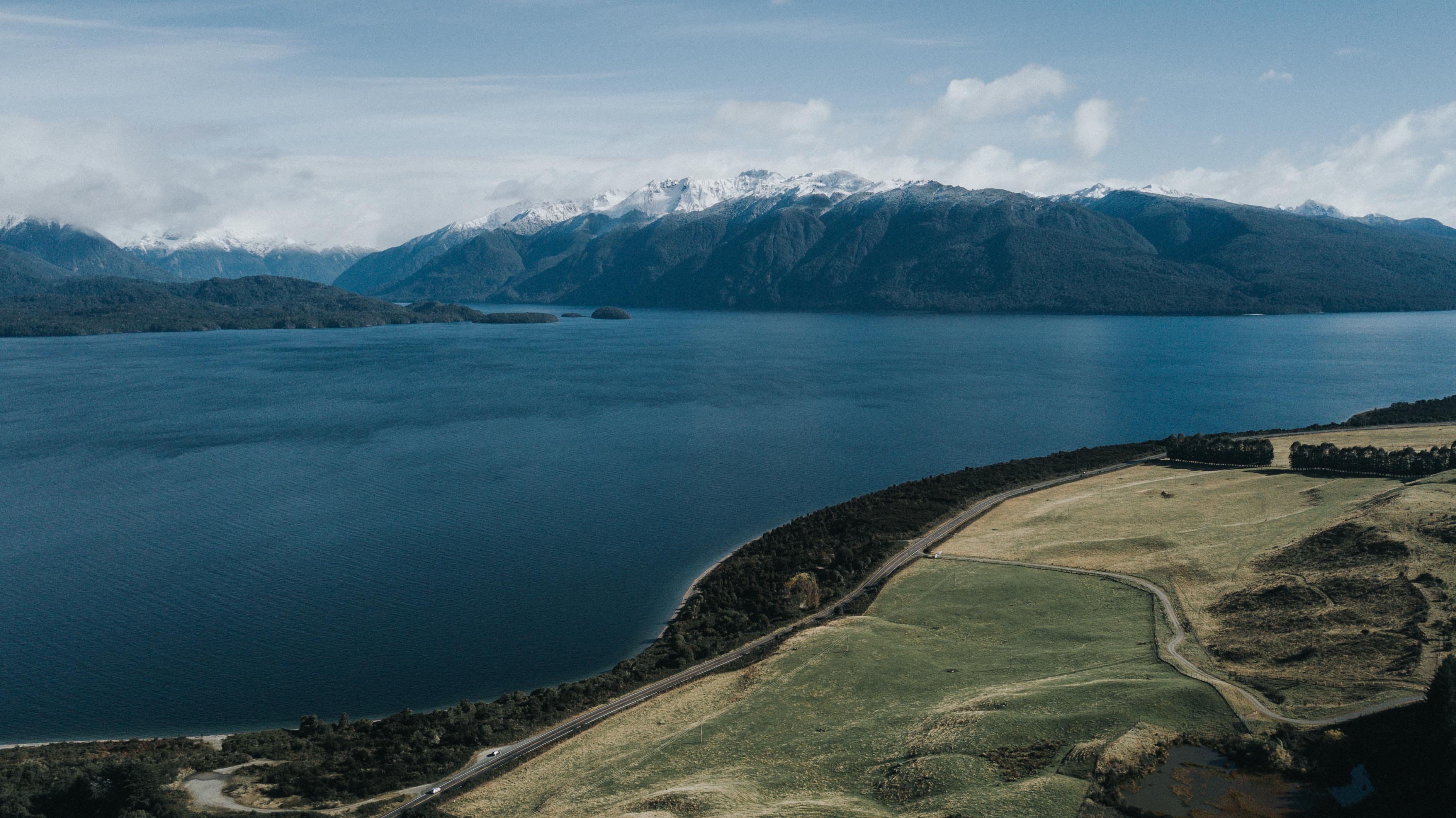 beauty in nature, travel, te anau, view, wanderlust, te anau lodge, aerial, tranquility, lake, snow, beach, landscape, new zealand, cloud - sky, HD Wallpaper