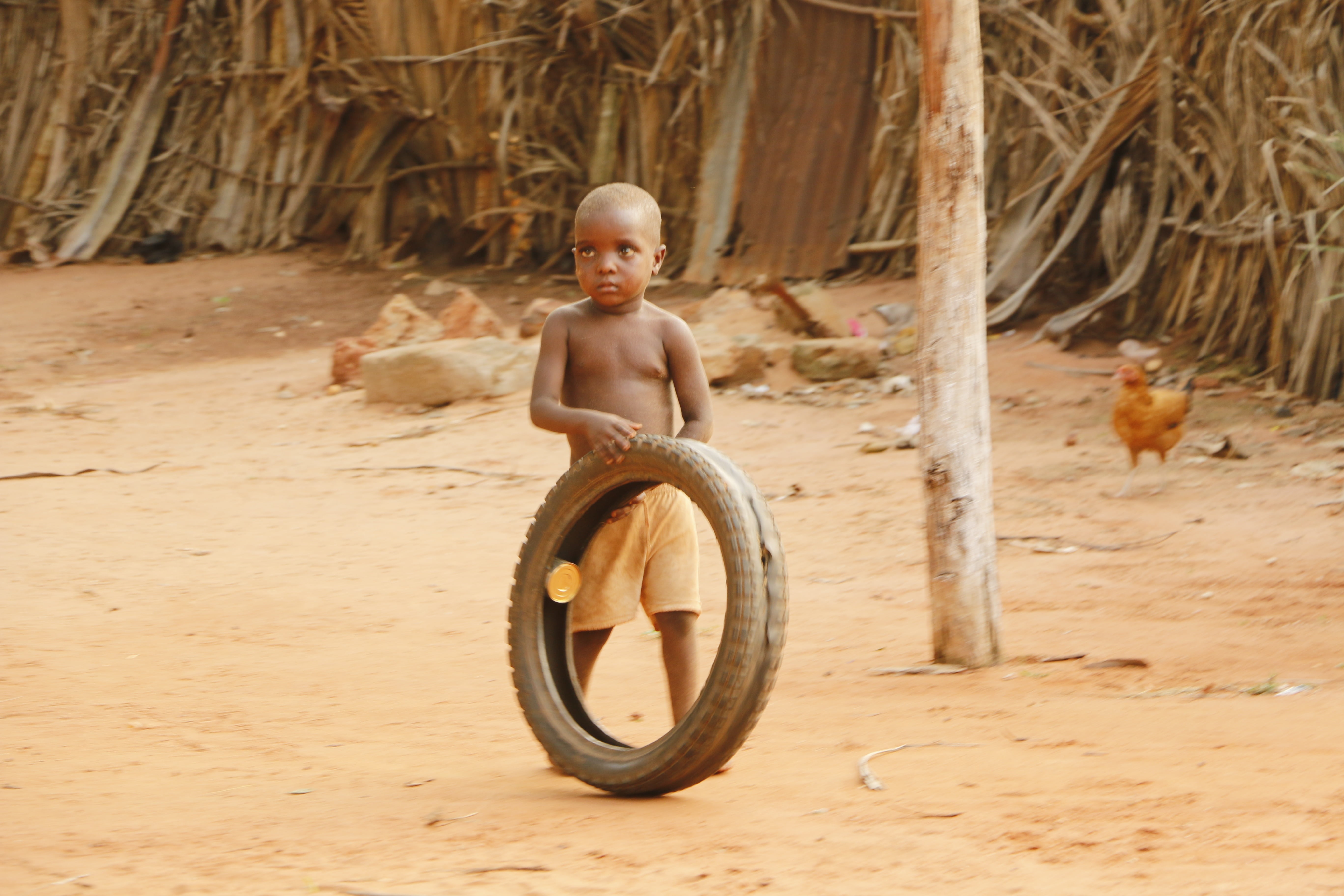portrait, sand, day, africa, boys, village, chest, nature, males, offspring, one person, front view, sitting, innocence, benin, land, childhood, wheel, HD Wallpaper