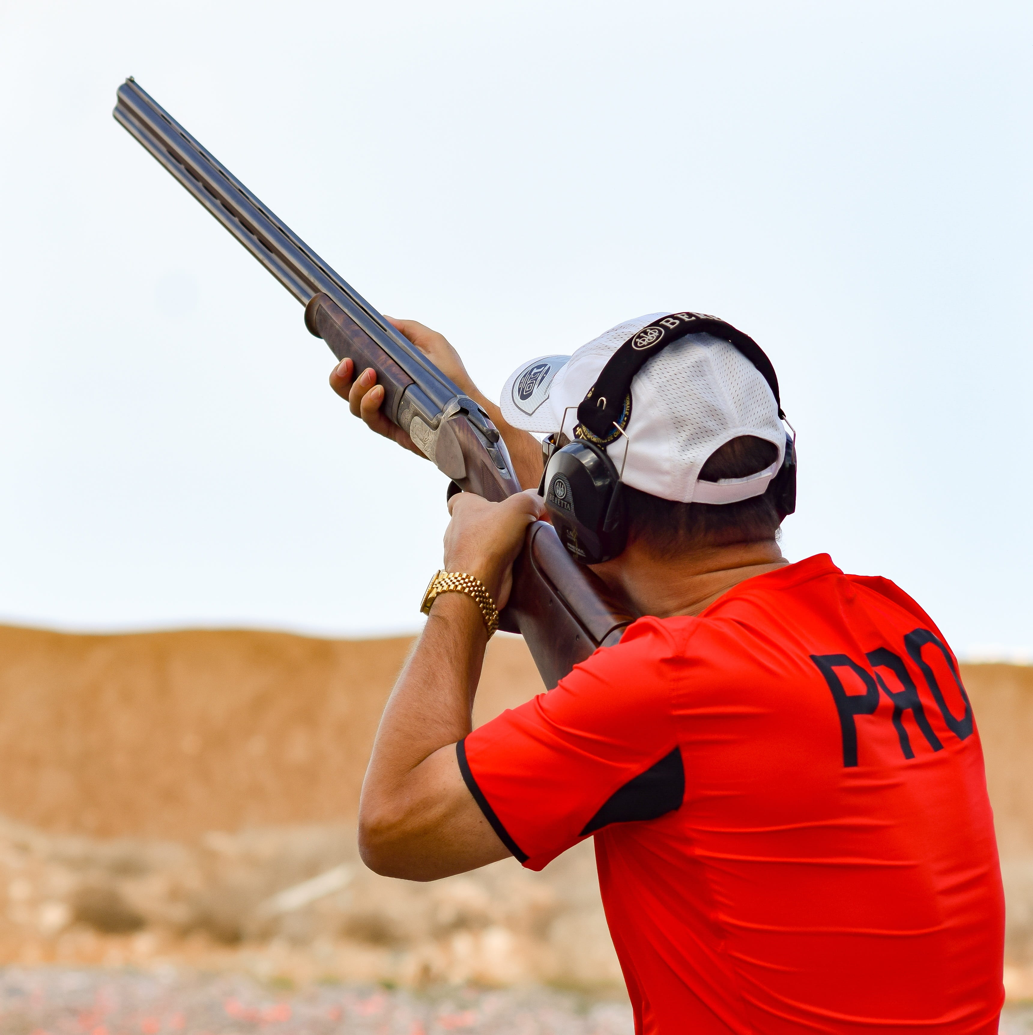 standing, leisure activity, 2K, clothing, rifle, day, aiming, holding, waist up, security, safety, sport, shoot, weapon, sky, shooting, man, hearing protection muffs, Phone HD Wallpaper