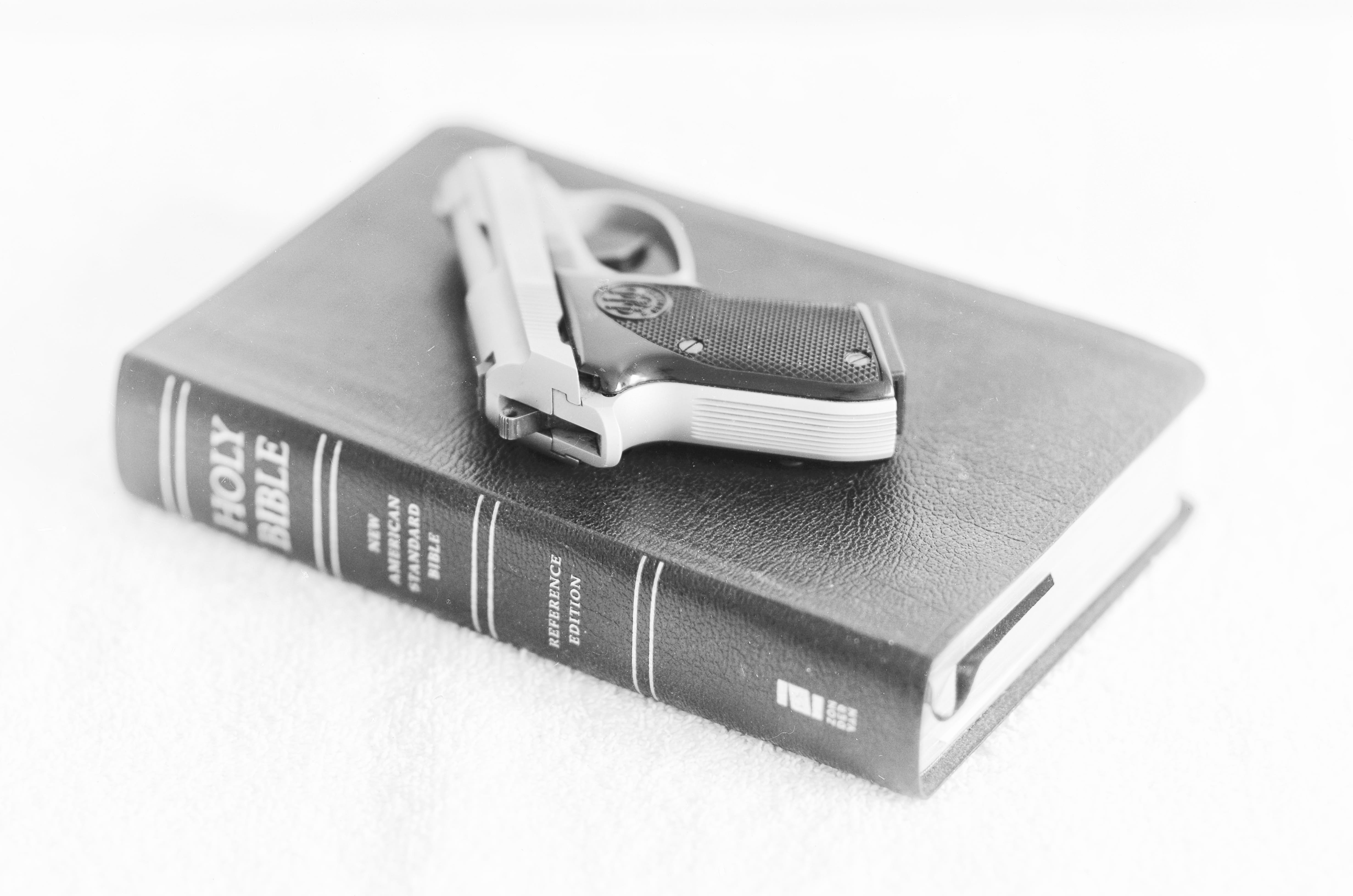 no people, communication, white background, gun, studio shot, two objects, security, indoors, 4K, Religion, safety, computer, Firearms, equipment, Bible, HD Wallpaper