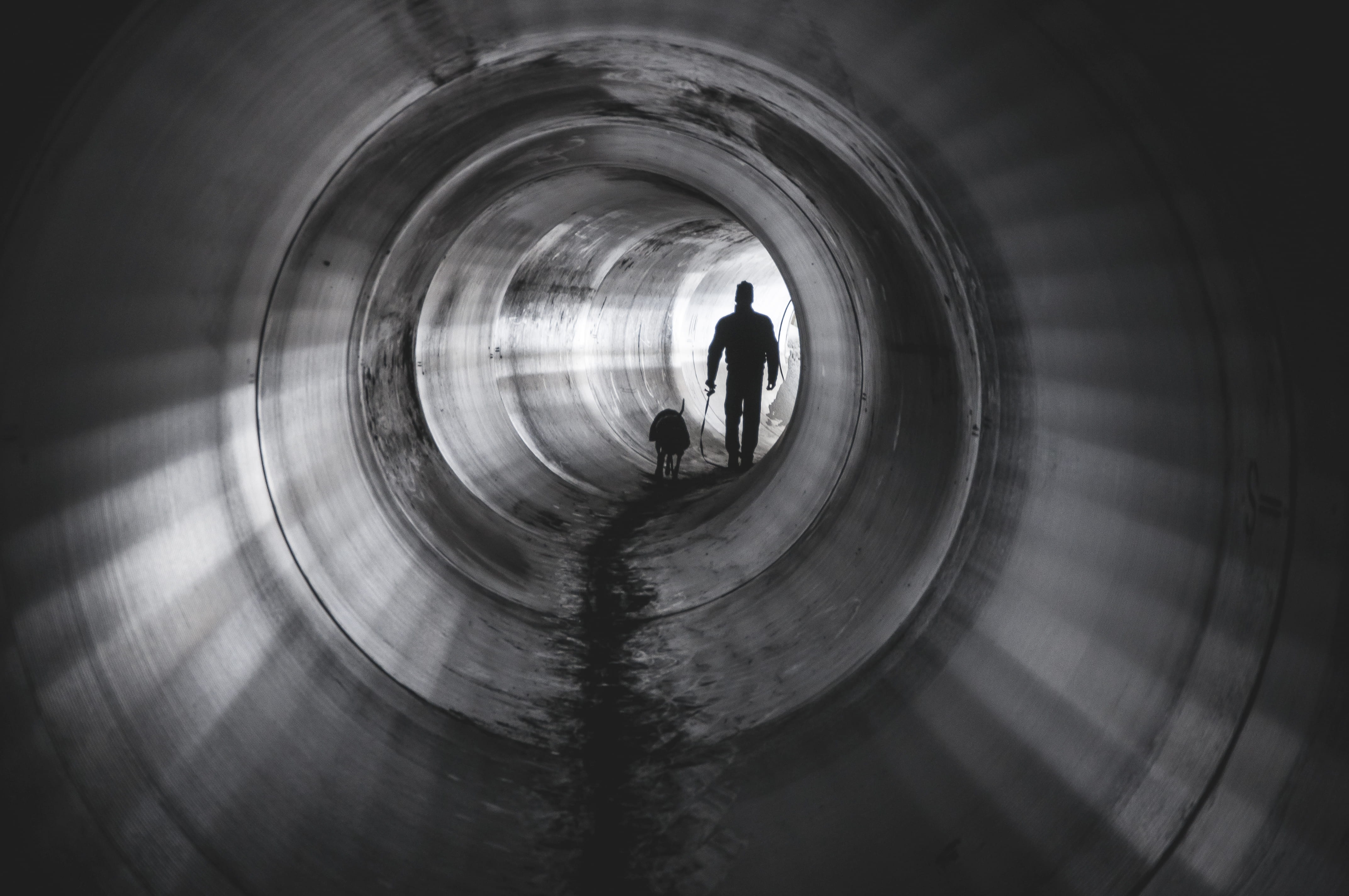 4K, silhouette, pipe - tube, real people, city, one person, monochrome, tunnel, blackandgrey, human, urban, men, bandw, blackandwhite, walk, person, leisure activity, HD Wallpaper
