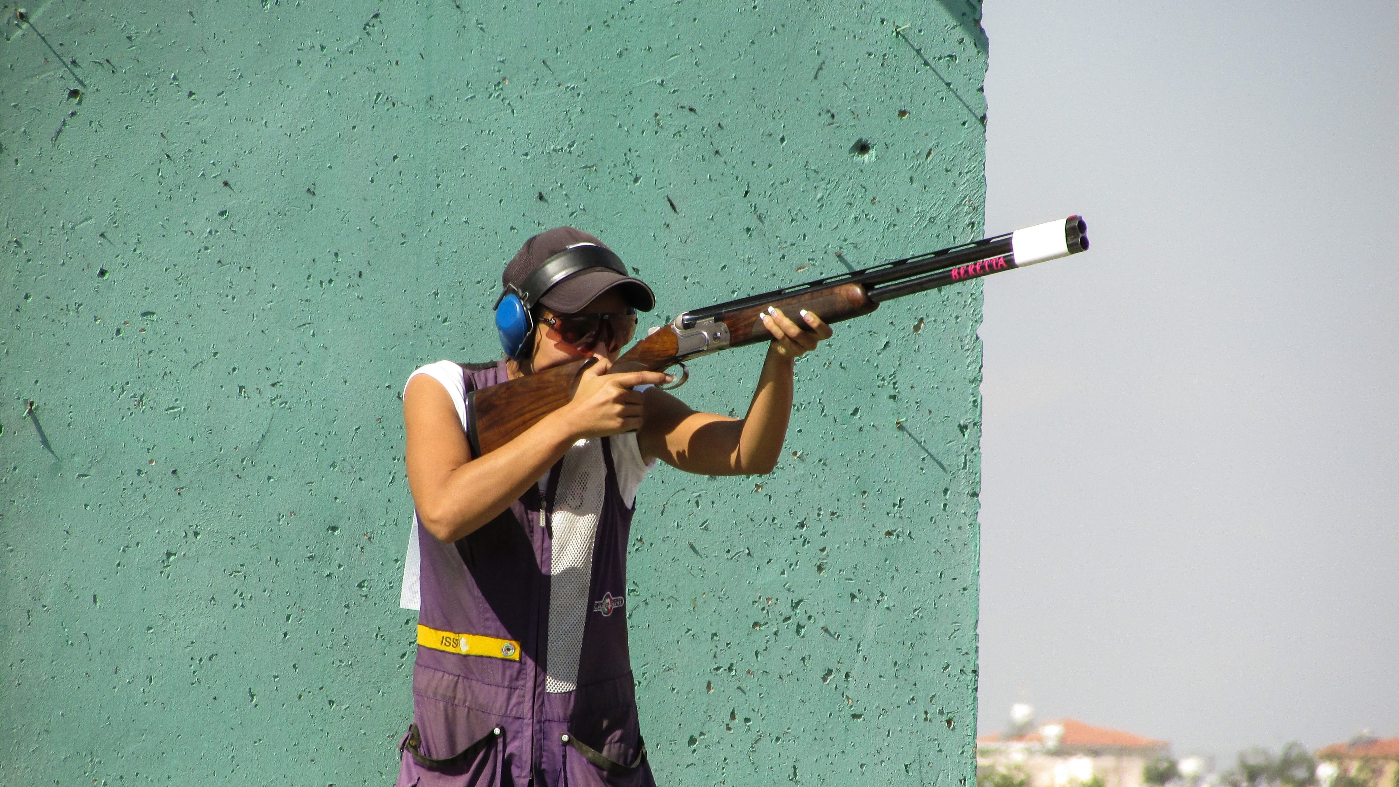 holding, rifle, sport, music, Shooting, green color, rear view, female, day, standing, shooting, game, cap, leisure activity, three quarter length, young adult, HD Wallpaper