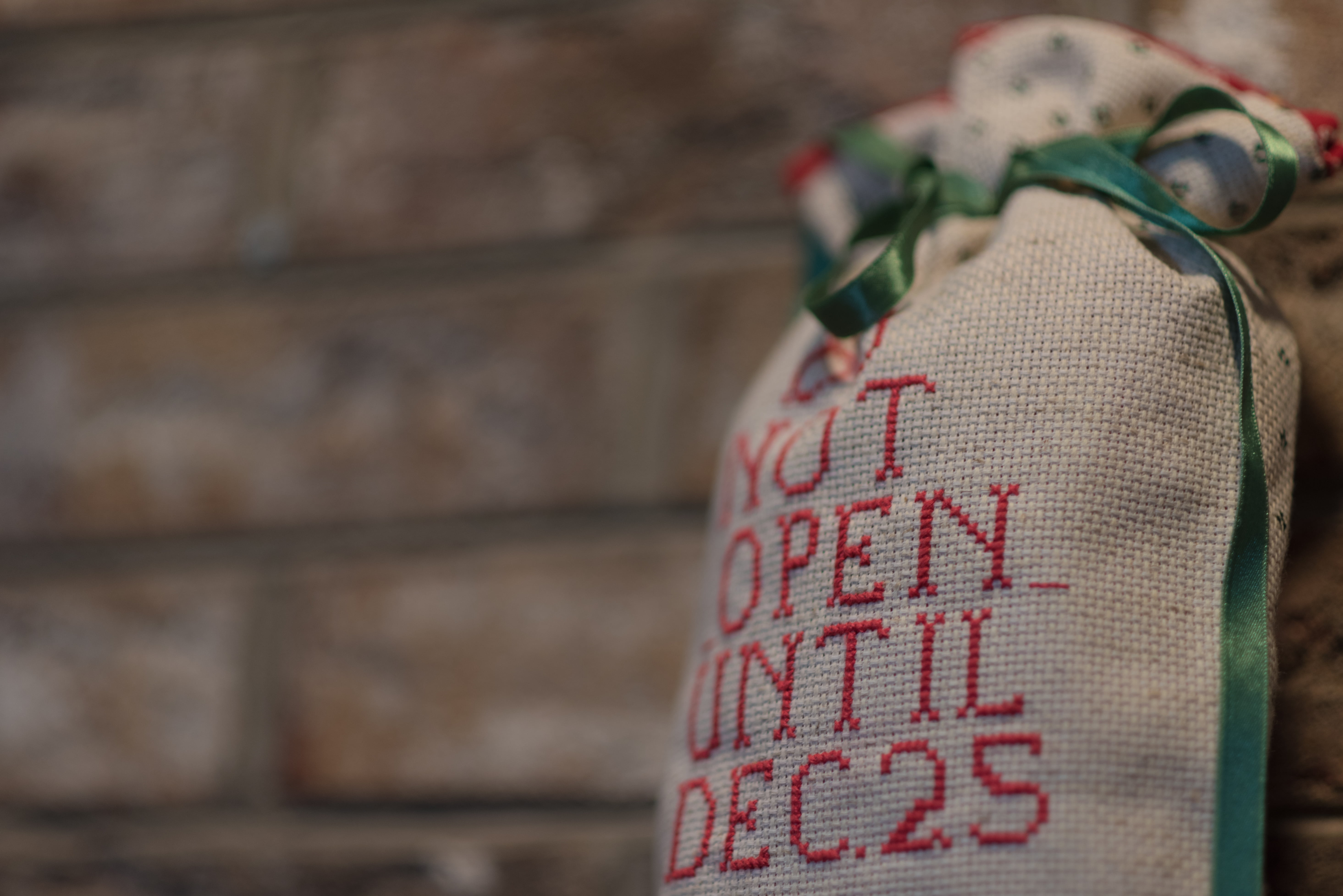 indoors, textile, hanging, text, red, festival, design, texture, retro, no people, 5K, travel, pattern, outdoors, sack, focus on foreground, brickwall, HD Wallpaper