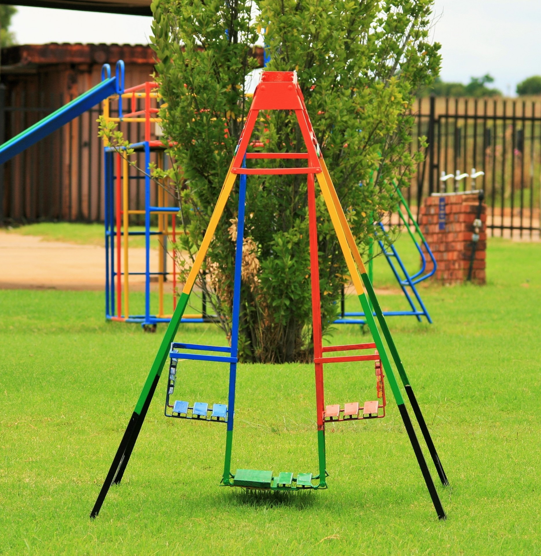 childhood, architecture, empty, absence, colorful, playground, day, outdoors, swing, tree, green, grass, nature, slide - play equipment, jungle gym, monkey bars, Phone HD Wallpaper