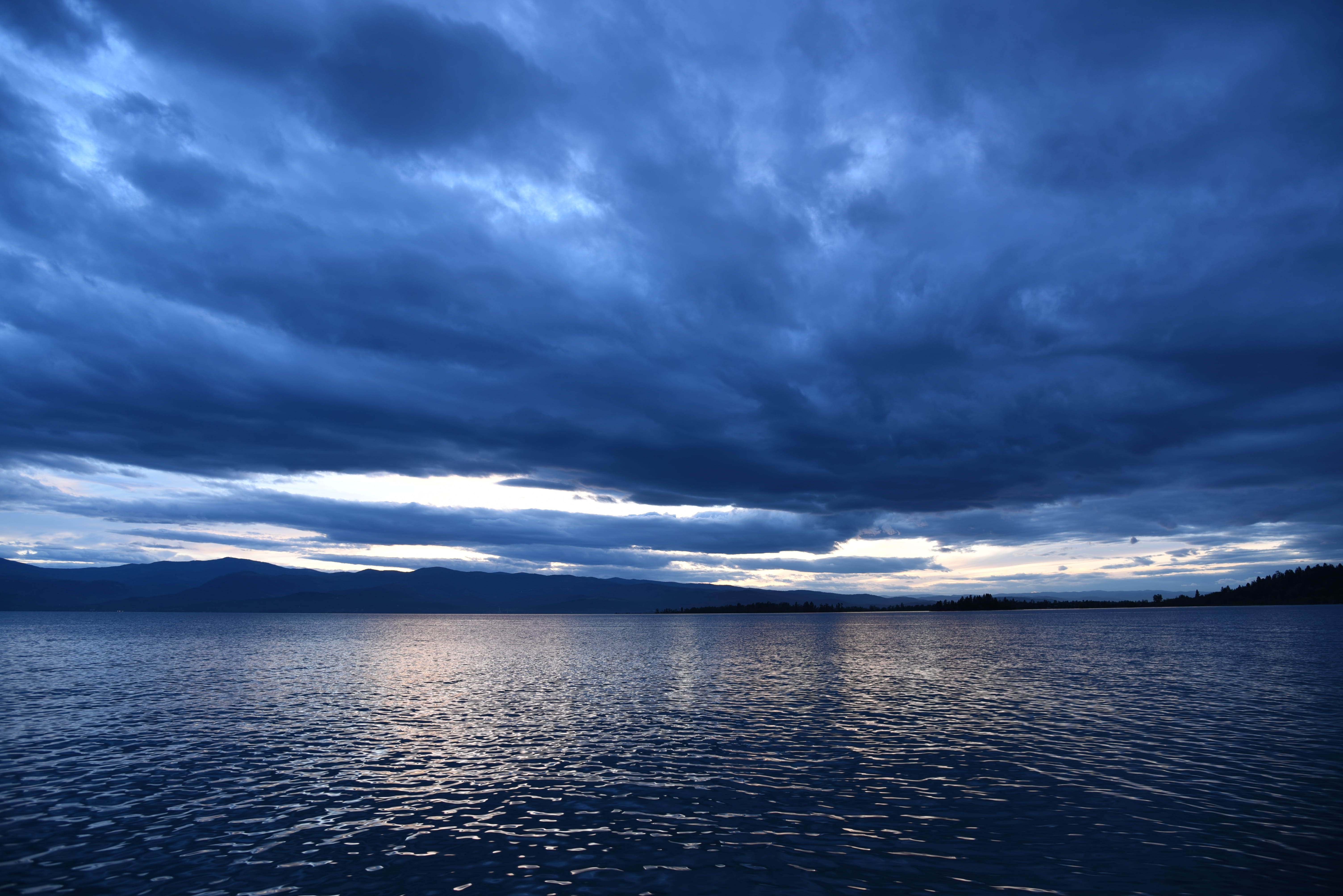 tranquil scene, big sky country, no people, blue, nature, sunset, 5K, dramatic sky, waterfront, sea, idyllic, non-urban scene, overcast, reflections, horizon over water, HD Wallpaper