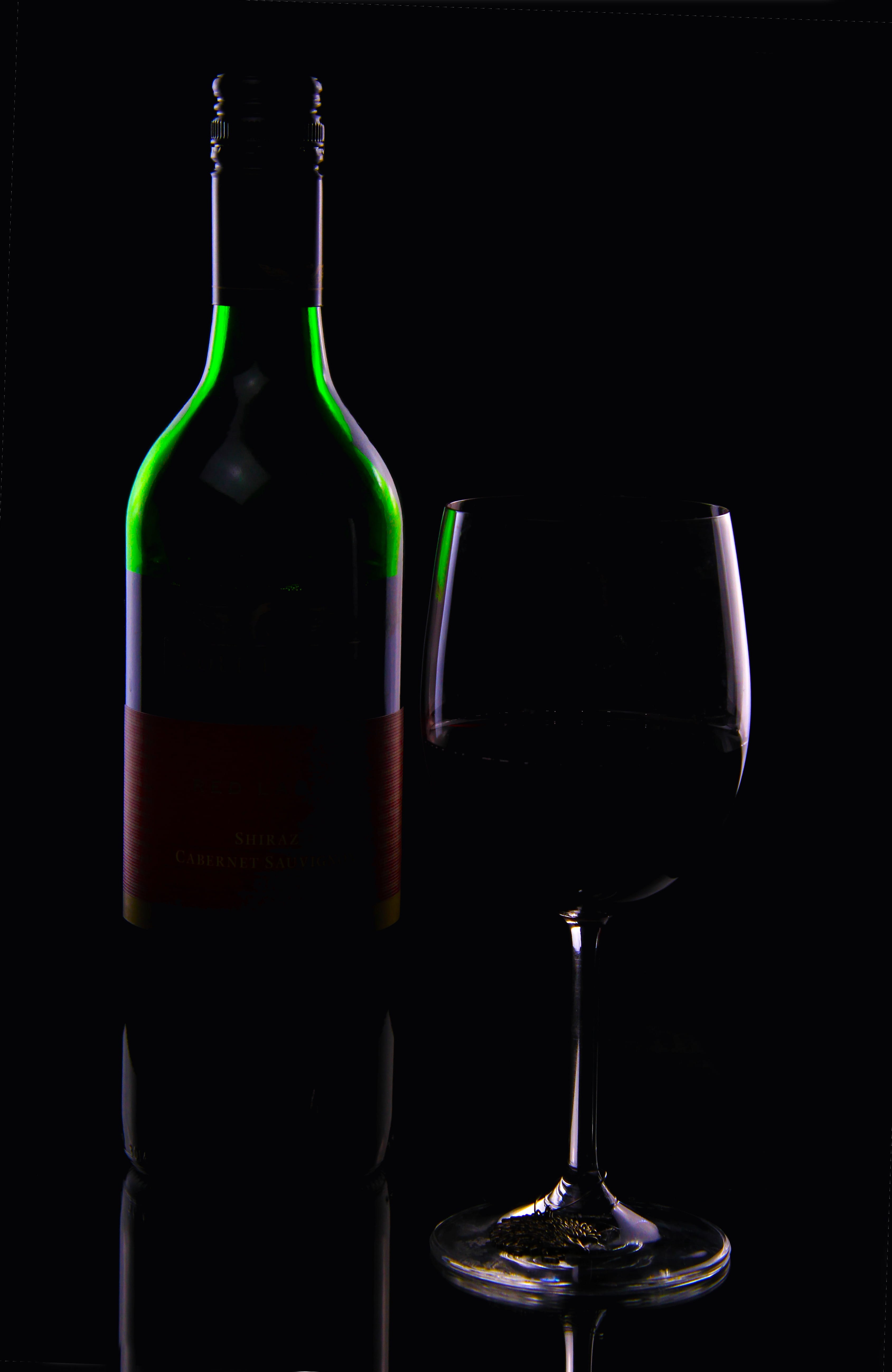 food and drink, elegance, beside, black background, Beverage, glass, footed, close-up, Alcohol, wine Bottle, Drink, still life, refreshment, spirit, red, Phone HD Wallpaper