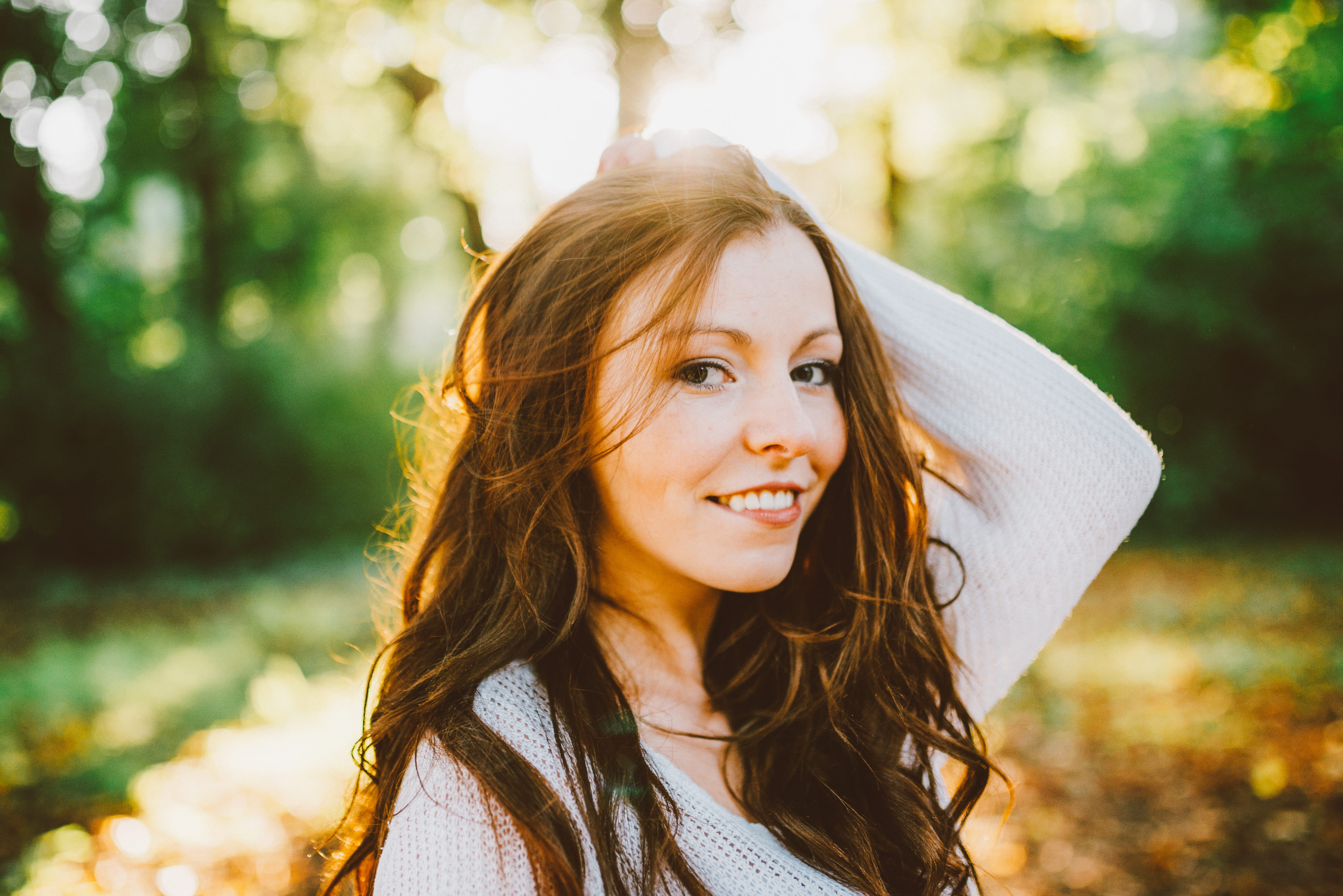 positive emotion, monica, long hair, young adult, beauty, outdoors, trees, looking at camera, beautiful people, one person, hair, women, smiling, tree, HD Wallpaper